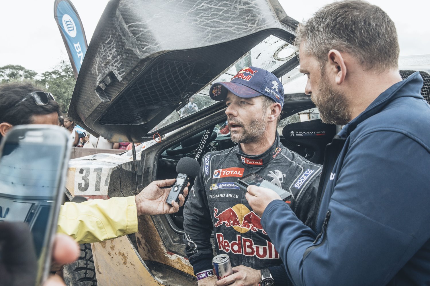 Loeb with reporters after winning Stage 3