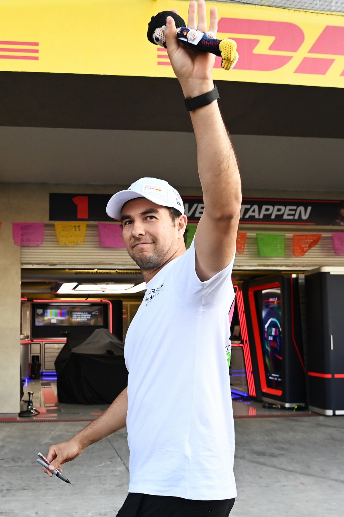 Sergio Perez of Mexico and Oracle Red Bull Racing greets fans in the Pitlane during previews ahead of the F1 Grand Prix of Mexico at Autodromo Hermanos Rodriguez on October 26, 2023 in Mexico City, Mexico. (Photo by Getty Images/Getty Images)