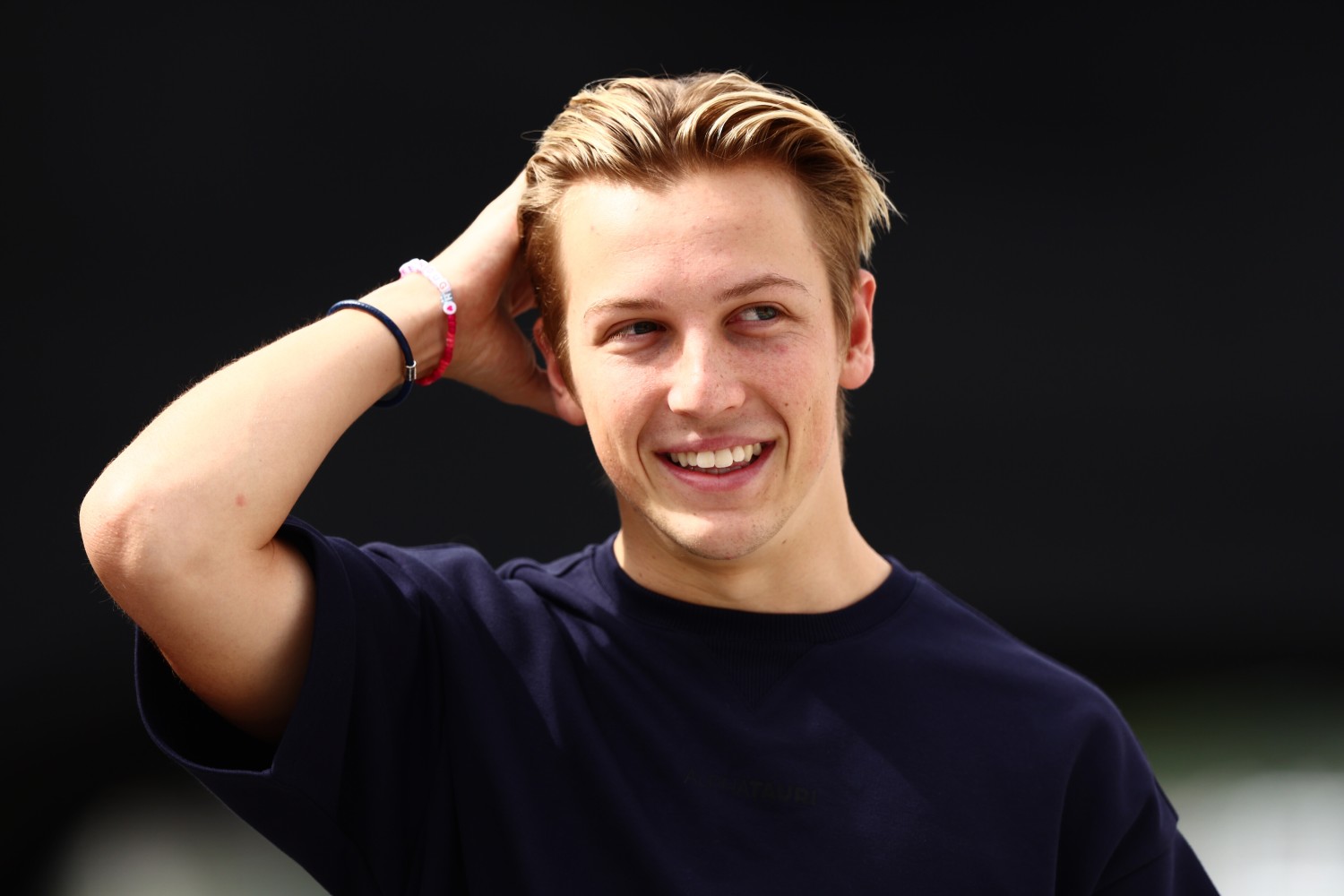 Liam Lawson of New Zealand and Scuderia AlphaTauri walks in the Paddock prior to practice ahead of the F1 Grand Prix of Japan at Suzuka International Racing Course on September 22, 2023 in Suzuka, Japan. (Photo by Clive Rose/Getty Images) // Getty Images / Red Bull Content Pool