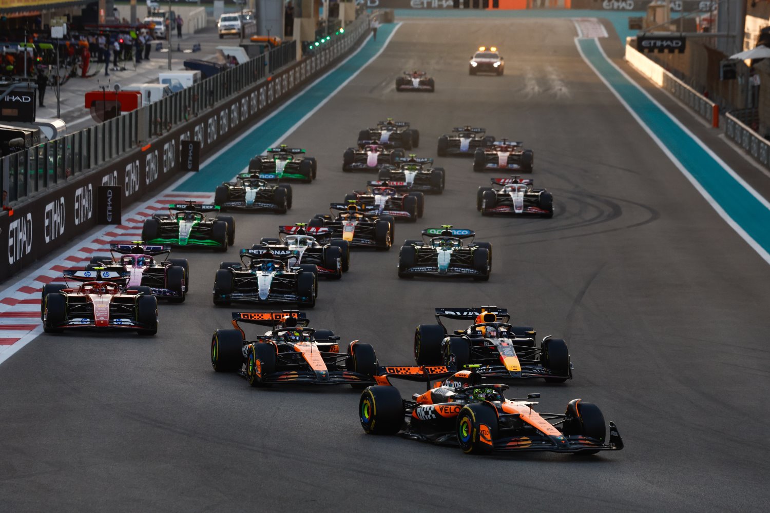 Lando Norris, McLaren MCL38, leads Oscar Piastri, McLaren MCL38, Max Verstappen, Red Bull Racing RB20, Carlos Sainz, Ferrari SF-24, Pierre Gasly, Alpine A524, and the rest of the field at the start