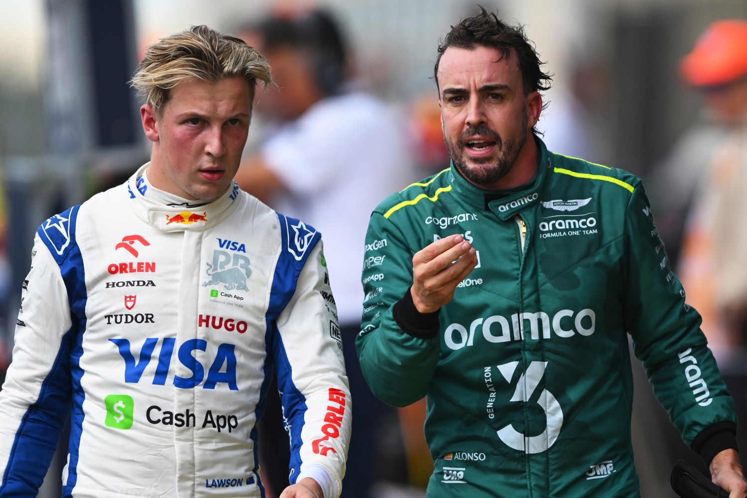 16th placed Liam Lawson of New Zealand and Visa Cash App RB and 18th placed Fernando Alonso of Spain and Aston Martin F1 Team talk in parc ferme during the Sprint ahead of the F1 Grand Prix of United States at Circuit of The Americas on October 19, 2024 in Austin, Texas. (Photo by Rudy Carezzevoli/Getty Images) // Getty Images / Red Bull Content Pool