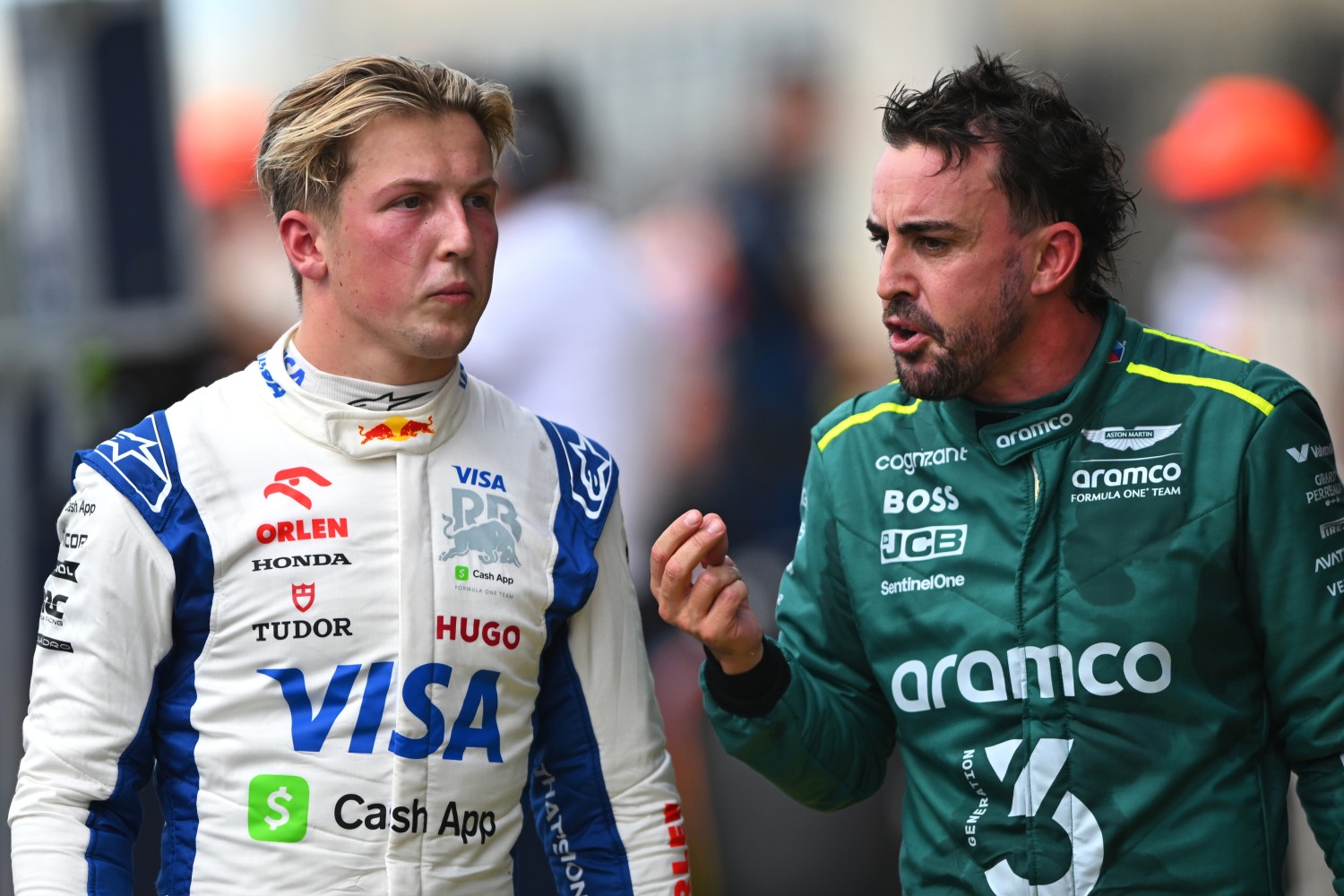 16th placed Liam Lawson of New Zealand and Visa Cash App RB and 18th placed Fernando Alonso of Spain and Aston Martin F1 Team talk in parc ferme during the Sprint ahead of the F1 Grand Prix of United States at Circuit of The Americas on October 19, 2024 in Austin, Texas. (Photo by Rudy Carezzevoli/Getty Images) // Getty Images / Red Bull Content Pool