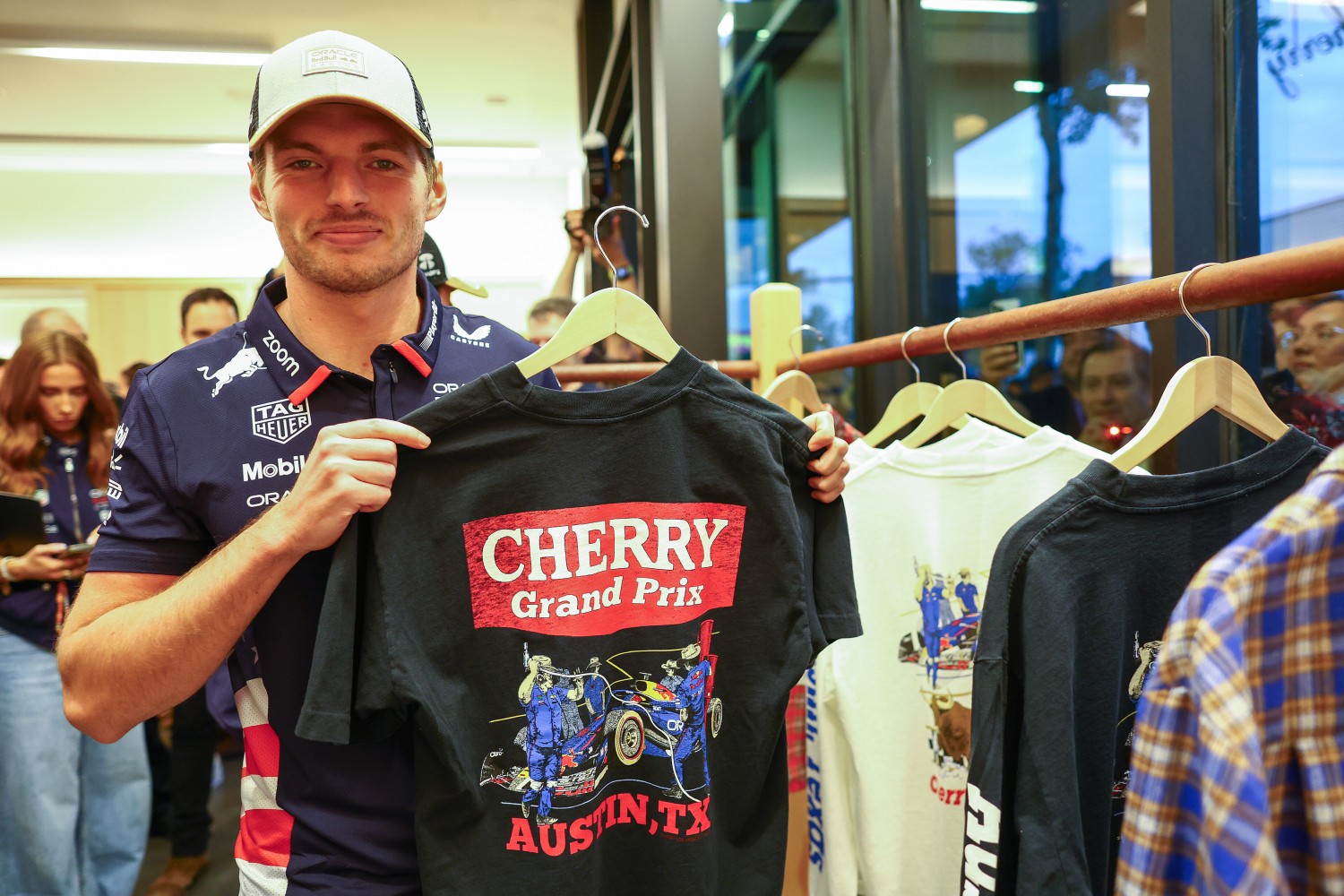 Max Verstappen and Cherry clothing line - During previews ahead of the F1 Grand Prix of United States at Circuit of The Americas on October 17, 2024 in Austin, Texas. (Photo by Mark Thompson/Getty Images)