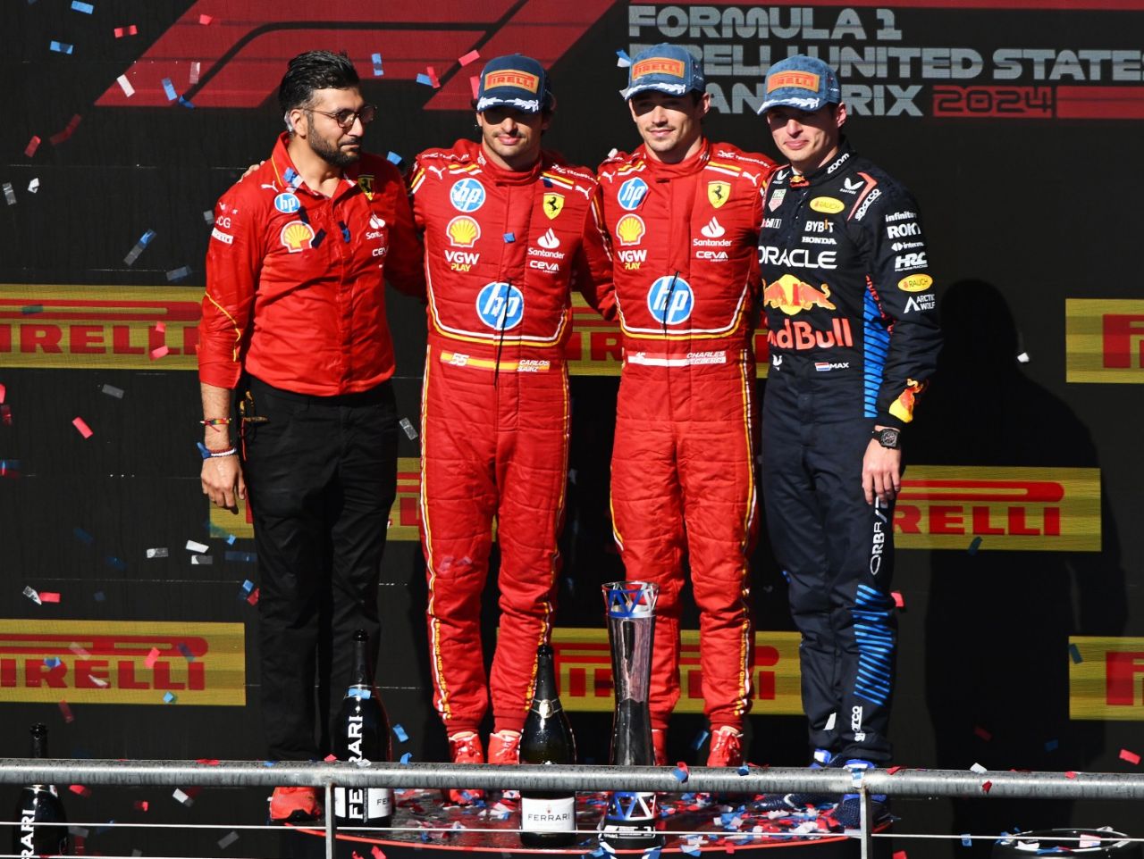 Race winner Charles Leclerc of Monaco and Ferrari, Second placed Carlos Sainz of Spain and Ferrari and Third placed Max Verstappen of the Netherlands and Oracle Red Bull Racing pose for a photo on the podium after the F1 Grand Prix of United States at Circuit of The Americas on October 20, 2024 in Austin, Texas. (Photo by Mark Sutton/Getty Images) // Getty Images / Red Bull Content Pool