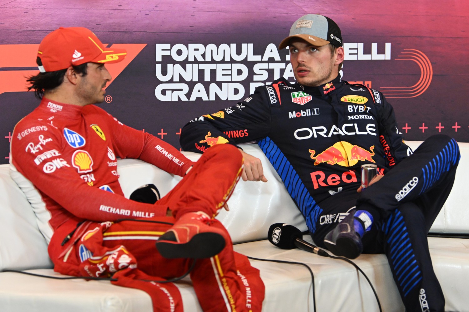 Sprint winner Max Verstappen of the Netherlands and Oracle Red Bull Racing talks with Second placed Carlos Sainz of Spain and Ferrari in the press conference after the Sprint ahead of the F1 Grand Prix of United States at Circuit of The Americas on October 19, 2024 in Austin, Texas. (Photo by Mark Sutton/Getty Images) // Getty Images / Red Bull Content Pool