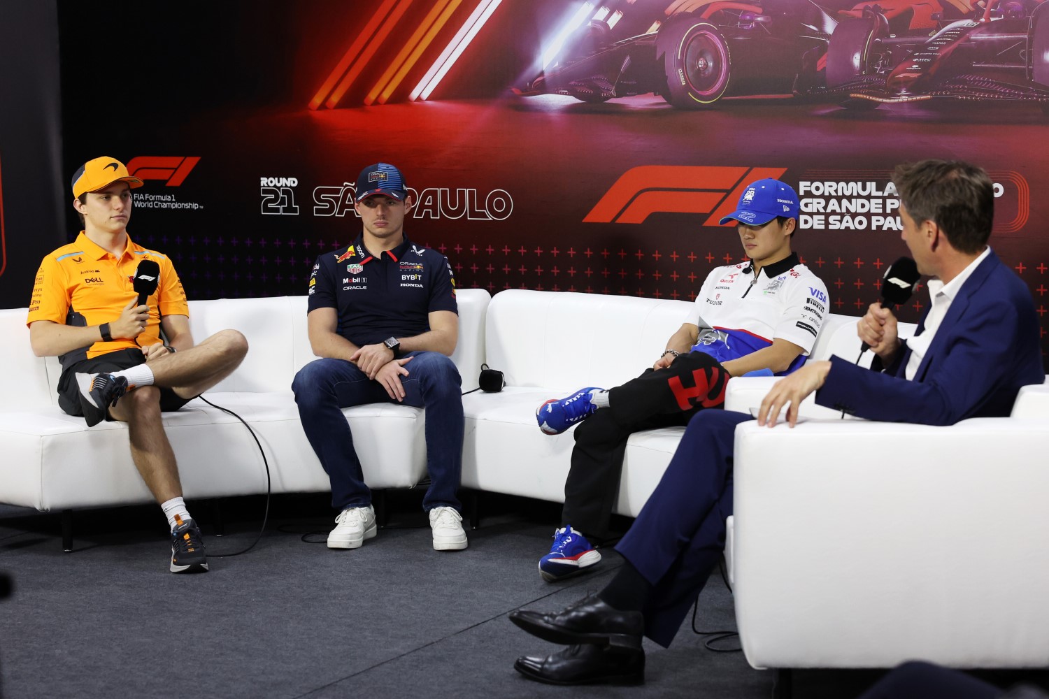 (L to R) Oscar Piastri of Australia and McLaren, Max Verstappen of the Netherlands and Oracle Red Bull Racing and Yuki Tsunoda of Japan and Visa Cash App RB attend the Drivers Press Conference during previews ahead of the F1 Grand Prix of Brazil at Autodromo Jose Carlos Pace on October 31, 2024 in Sao Paulo, Brazil. (Photo by Lars Baron/Getty Images) // Getty Images / Red Bull Content Pool 