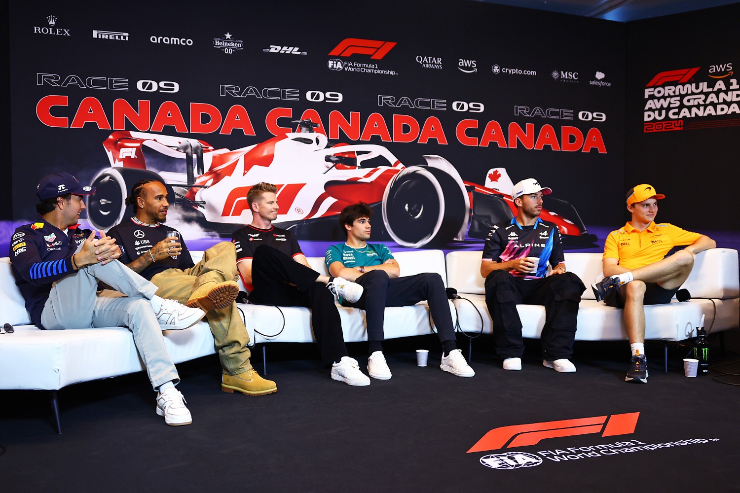 L to R: Sergio Perez of Mexico and Oracle Red Bull Racing, Lewis Hamilton of Great Britain and Mercedes, Nico Hulkenberg of Germany and Haas F1, Lance Stroll of Canada and Aston Martin F1 Team, Pierre Gasly of France and Alpine F1 and Oscar Piastri of Australia and McLaren attend the press conference after during previews ahead of the F1 Grand Prix of Canada at Circuit Gilles Villeneuve on June 06, 2024 in Montreal, Quebec. (Photo by Clive Rose/Getty Images) // Getty Images / Red Bull Content Pool