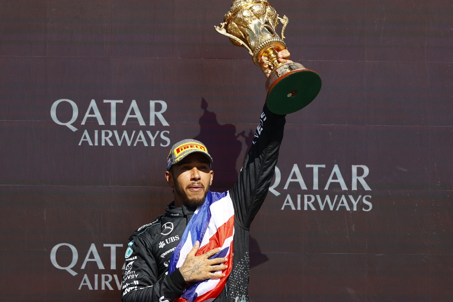 Lewis Hamilton, Mercedes-AMG F1 Team, 1st position, lifts the winners trophy during the British GP at Silverstone Circuit on Sunday July 07, 2024 in Northamptonshire, United Kingdom. (Photo by Andy Hone / LAT Images)