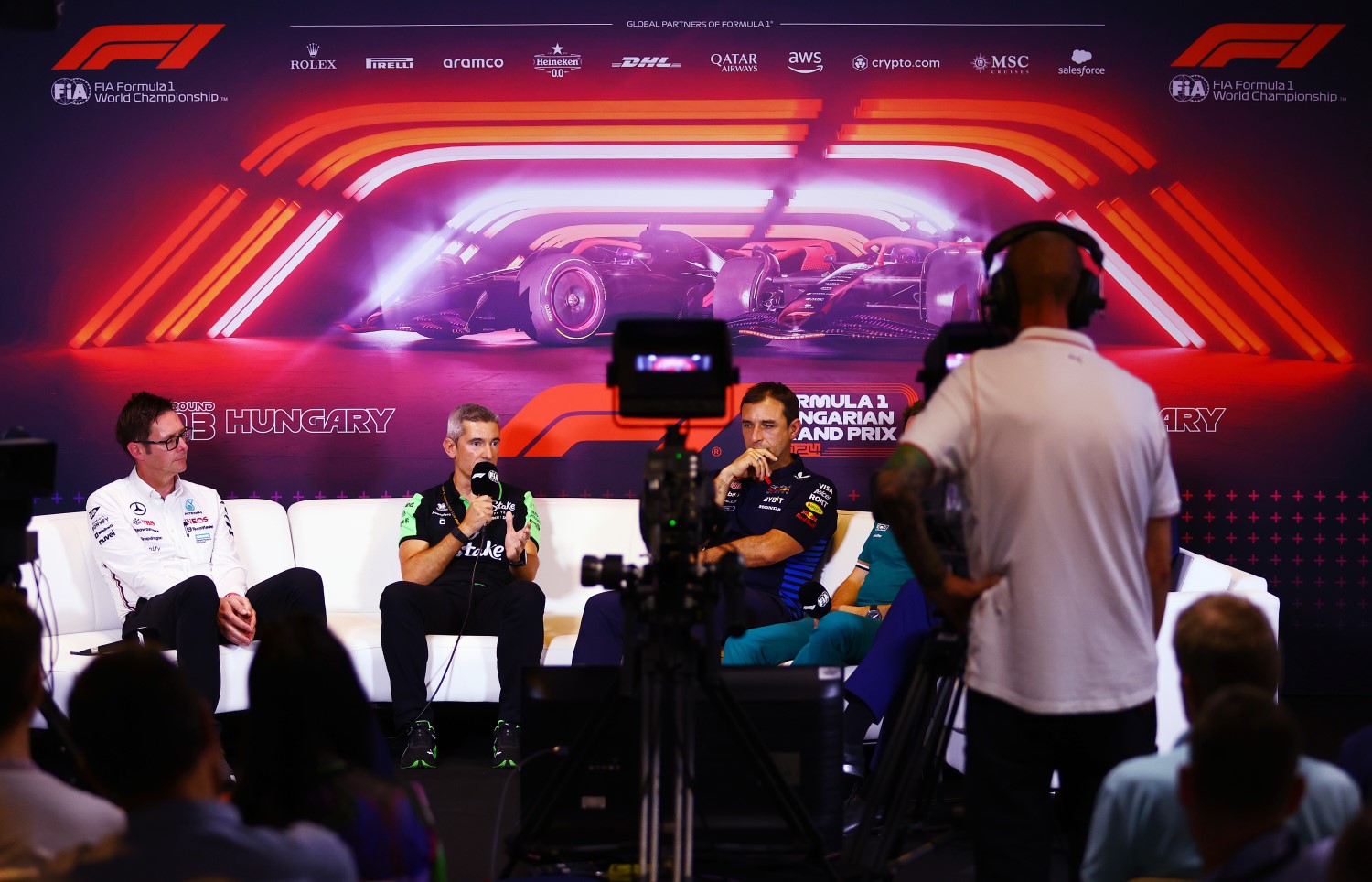 Xevi Pujolar, Race Director at Stake F1 Team Kick Sauber talks at the Team Principals Press Conference alongside Andrew Shovlin, Trackside Engineering Director of Mercedes GP and Pierre Wache, Chief Engineer of Performance Engineering at Oracle Red Bull Racing during practice ahead of the F1 Grand Prix of Hungary at Hungaroring on July 19, 2024 in Budapest, Hungary. (Photo by Bryn Lennon/Getty Images) // Getty Images / Red Bull Content Pool