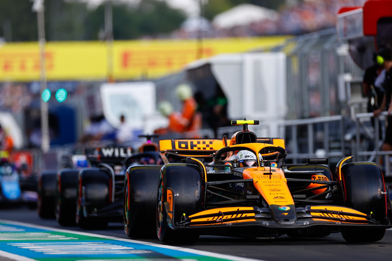 Lando Norris, McLaren MCL38, leads Alex Albon, Williams FW46, in the pit lane during the Hungarian GP at Hungaroring on Friday July 19, 2024 in Budapest, Hungary. (Photo by Andy Hone / LAT Images)