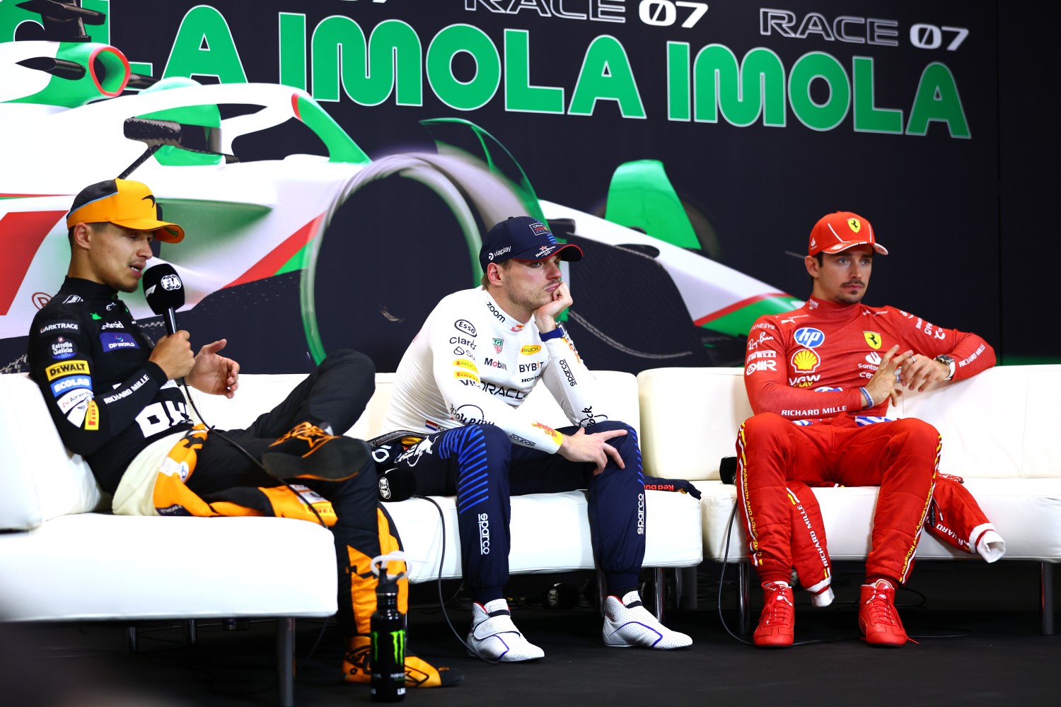 Race winner Max Verstappen of the Netherlands and Oracle Red Bull Racing, Second placed Lando Norris of Great Britain and McLaren and third placed Charles Leclerc of Monaco and Ferrari attend the press conference after the F1 Grand Prix of Emilia-Romagna at Autodromo Enzo e Dino Ferrari Circuit on May 19, 2024 in Imola, Italy. (Photo by Bryn Lennon/Getty Images)