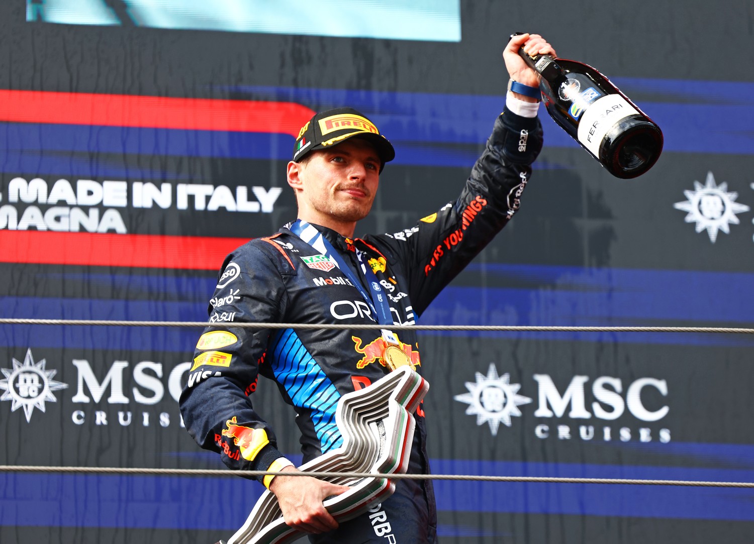 Race winner Max Verstappen of the Netherlands and Oracle Red Bull Racing celebrates on the podium during the F1 Grand Prix of Emilia-Romagna at Autodromo Enzo e Dino Ferrari Circuit on May 19, 2024 in Imola, Italy. (Photo by Mark Thompson/Getty Images)