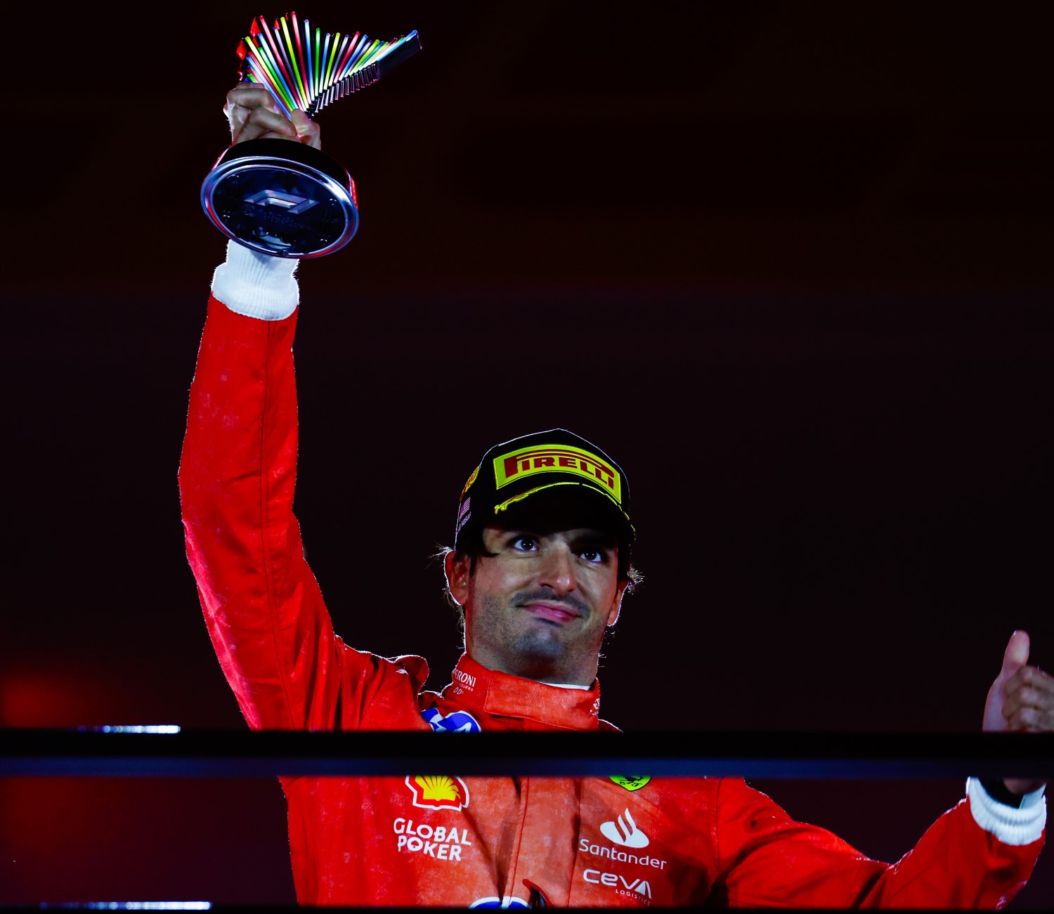 Carlos Sainz, Scuderia Ferrari, 3rd position, lifts the trophy in celebration during the Las Vegas GP at Streets of Las Vegas on Saturday November 23, 2024, United States of America. (Photo by Sam Bloxham / LAT Images)