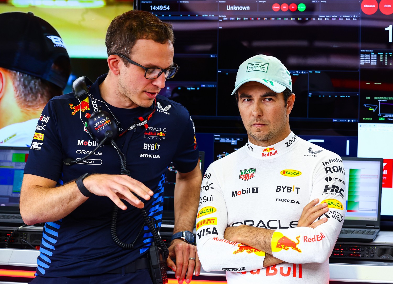 Sergio Perez of Mexico and Oracle Red Bull Racing talks with race engineer Hugh Bird in the garage prior to qualifying ahead of the F1 Grand Prix of Mexico at Autodromo Hermanos Rodriguez on October 26, 2024 in Mexico City, Mexico. (Photo by Mark Thompson/Getty Images) // Getty Images / Red Bull Content Pool