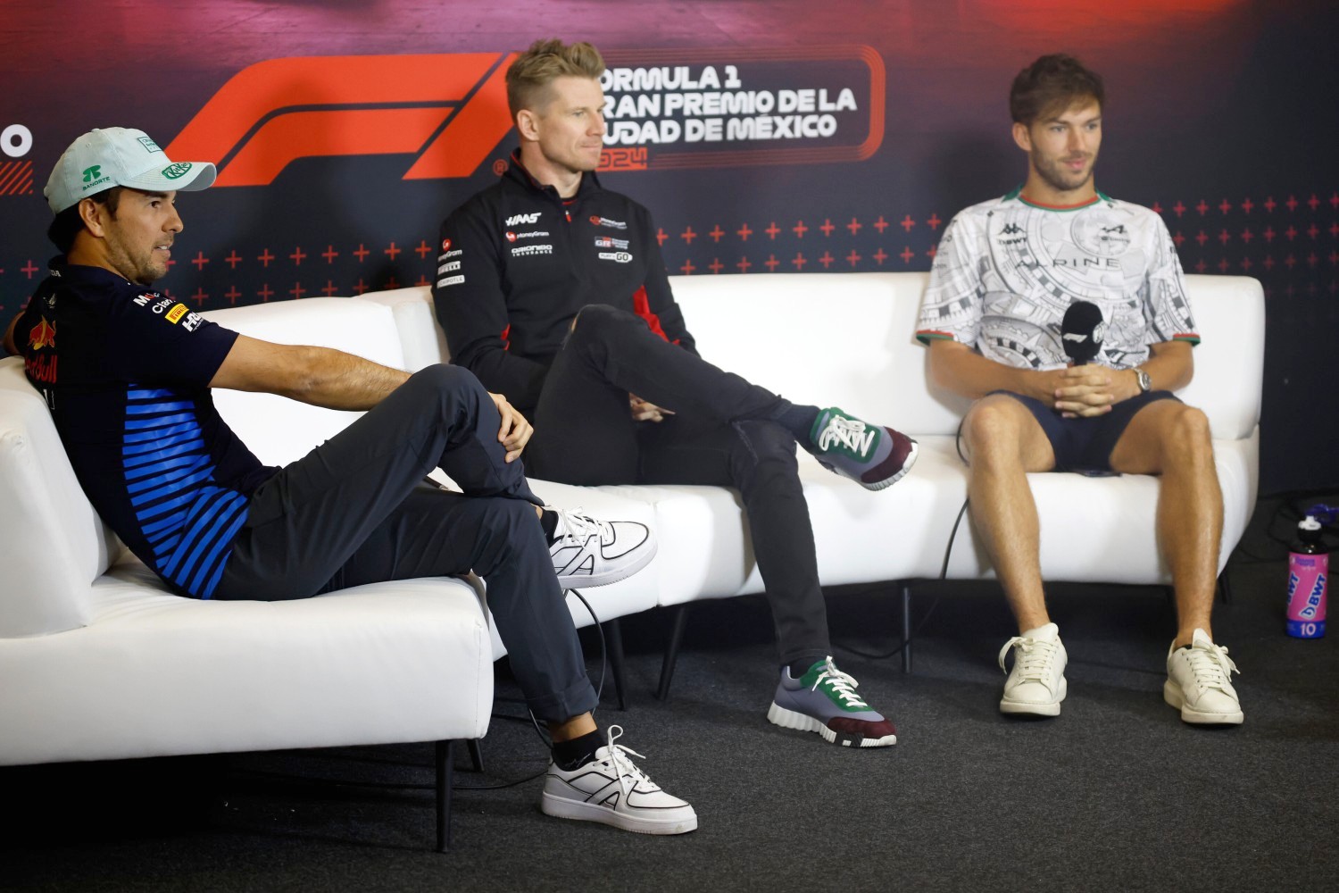 Sergio Perez of Mexico and Oracle Red Bull Racing, Nico Hulkenberg of Germany and Haas F1 and Pierre Gasly of France and Alpine F1 attend the Drivers Press Conference during previews ahead of the F1 Grand Prix of Mexico at Autodromo Hermanos Rodriguez on October 24, 2024 in Mexico City, Mexico. (Photo by Chris Graythen/Getty Images) // Getty Images / Red Bull Content Pool