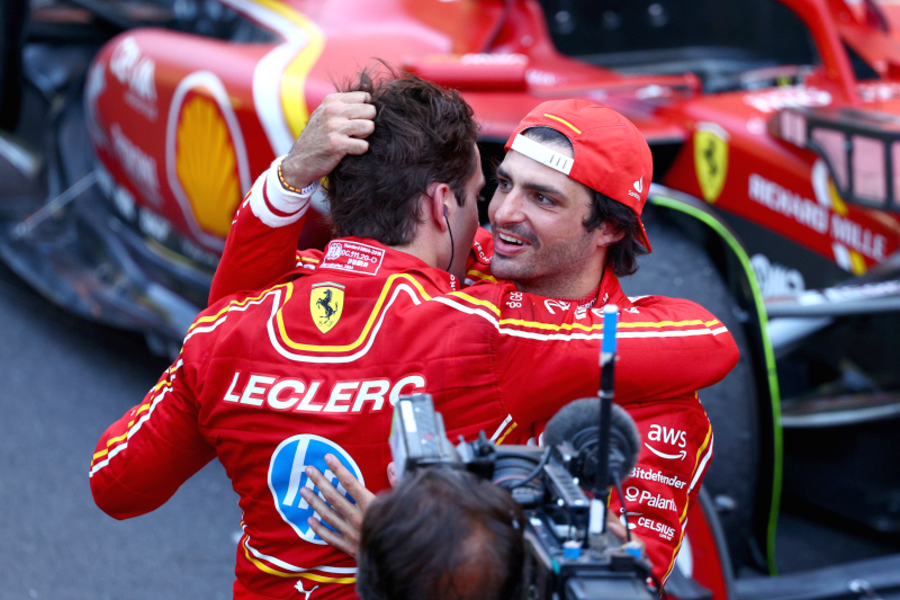 Carlos Sainz Jr. congratulates his Ferrari teammate Charles Leclerc.
