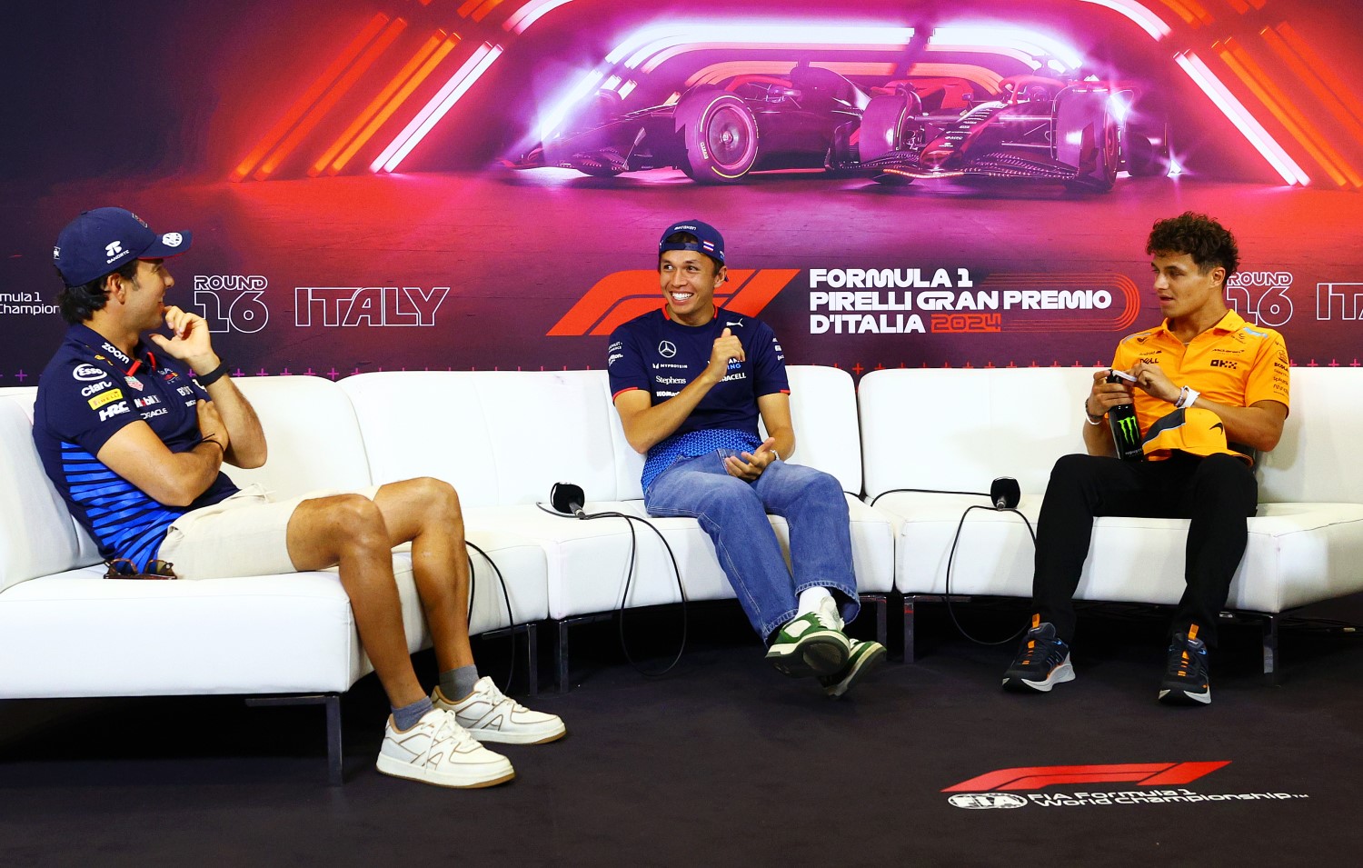 (L-R) Sergio Perez of Mexico and Oracle Red Bull Racing, Alexander Albon of Thailand and Williams, and Lando Norris of Great Britain and McLaren attend the Drivers Press Conference during previews ahead of the F1 Grand Prix of Italy at Autodromo Nazionale Monza on August 29, 2024 in Monza, Italy. (Photo by Clive Rose/Getty Images) // Getty Images / Red Bull Content Pool