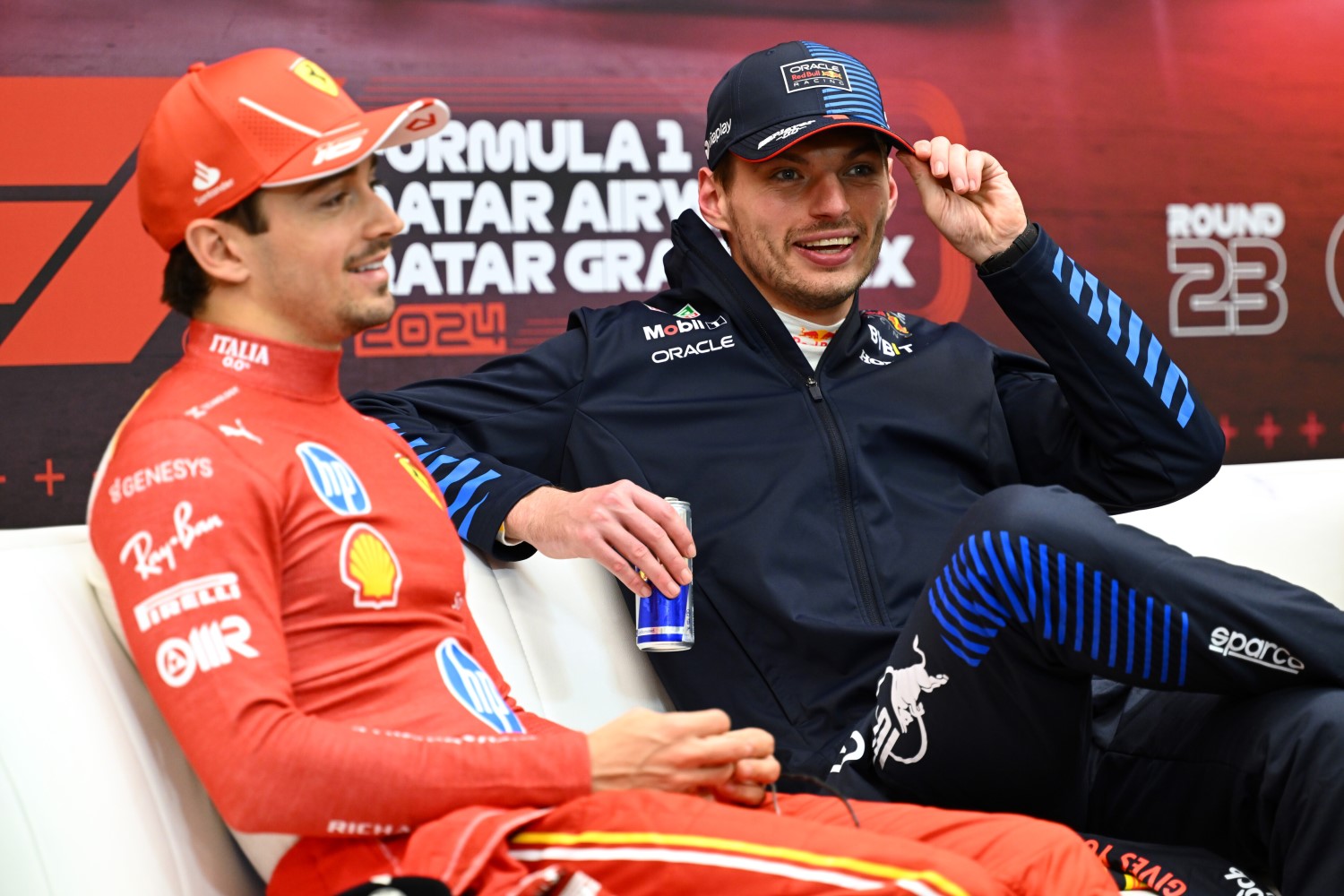 Race winner Max Verstappen of the Netherlands and Oracle Red Bull Racing and Charles Leclerc of Monaco and Ferrari attend the press conference after the F1 Qatar GP at Lusail International Circuit on December 01, 2024 in Lusail City, Qatar. (Photo by Mark Sutton/Getty Images) // Getty Images / Red Bull Content Pool