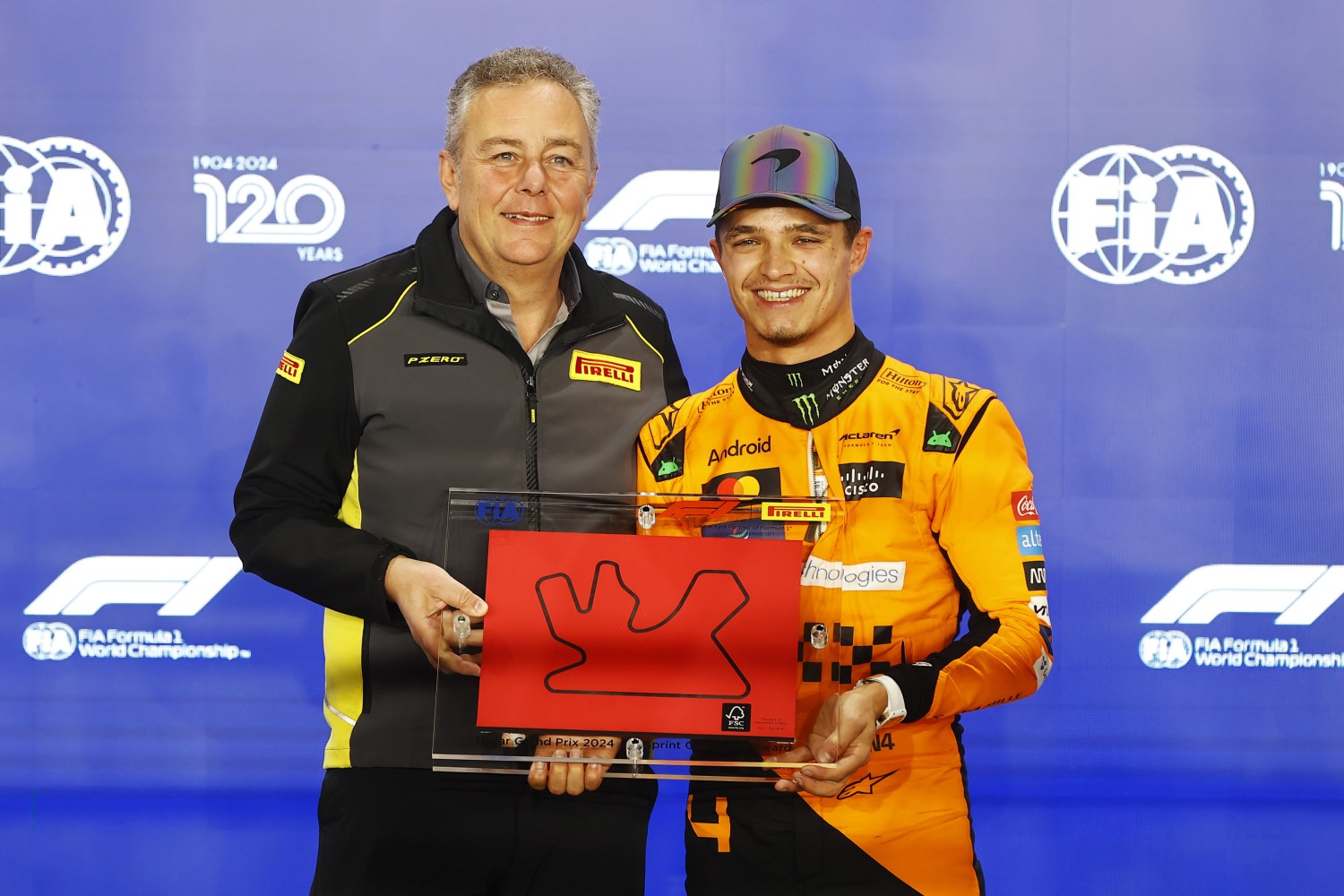 Mario Isola, Racing Manager, Pirelli Motorsport, presents Lando Norris, McLaren F1 Team, with the Pirelli Sprint Pole Award during the Qatar GP at Losail International Circuit on Friday November 29, 2024 in Losail, Qatar. (Photo by Andy Hone / LAT Images)