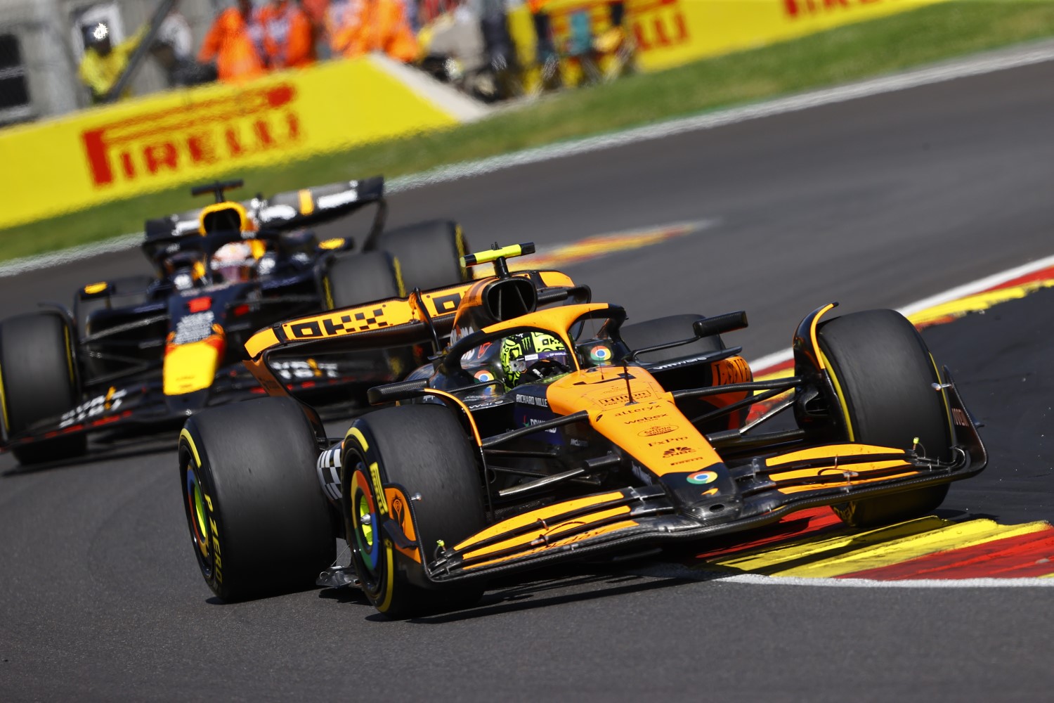 Lando Norris, McLaren MCL38, leads Max Verstappen, Red Bull Racing RB20