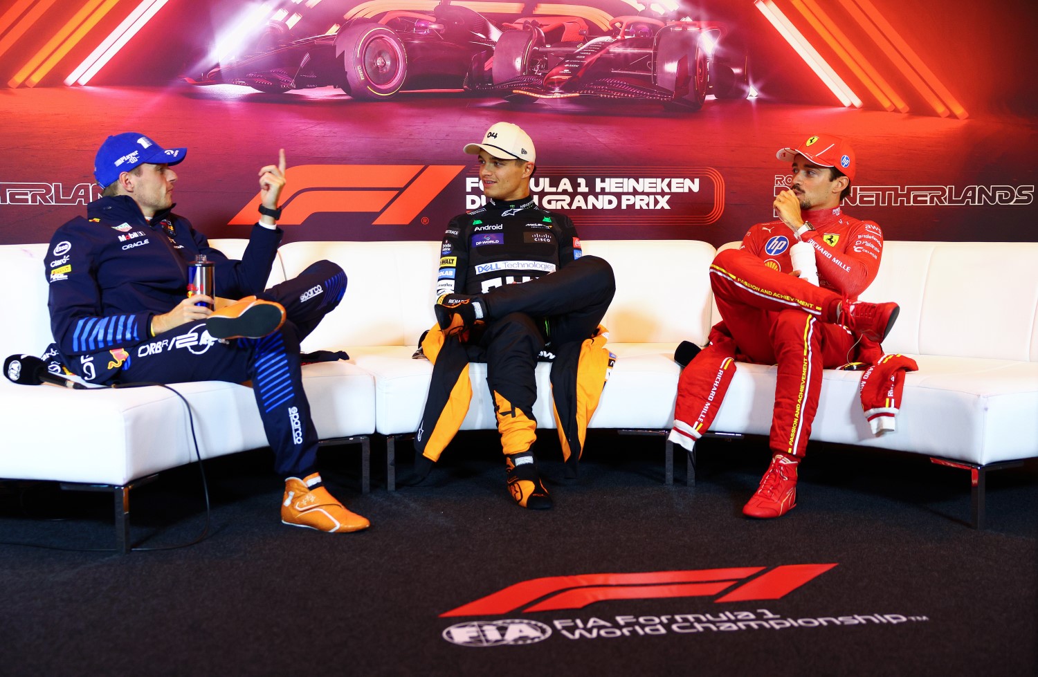 Race winner Lando Norris of Great Britain and McLaren, Second placed Max Verstappen of the Netherlands and Oracle Red Bull Racing and Third placed Charles Leclerc of Monaco and Ferrari attend the press conference after the F1 Dutch GP at Circuit Zandvoort on August 25, 2024 in Zandvoort, Netherlands. (Photo by Clive Rose/Getty Images) // Getty Images / Red Bull Content Pool