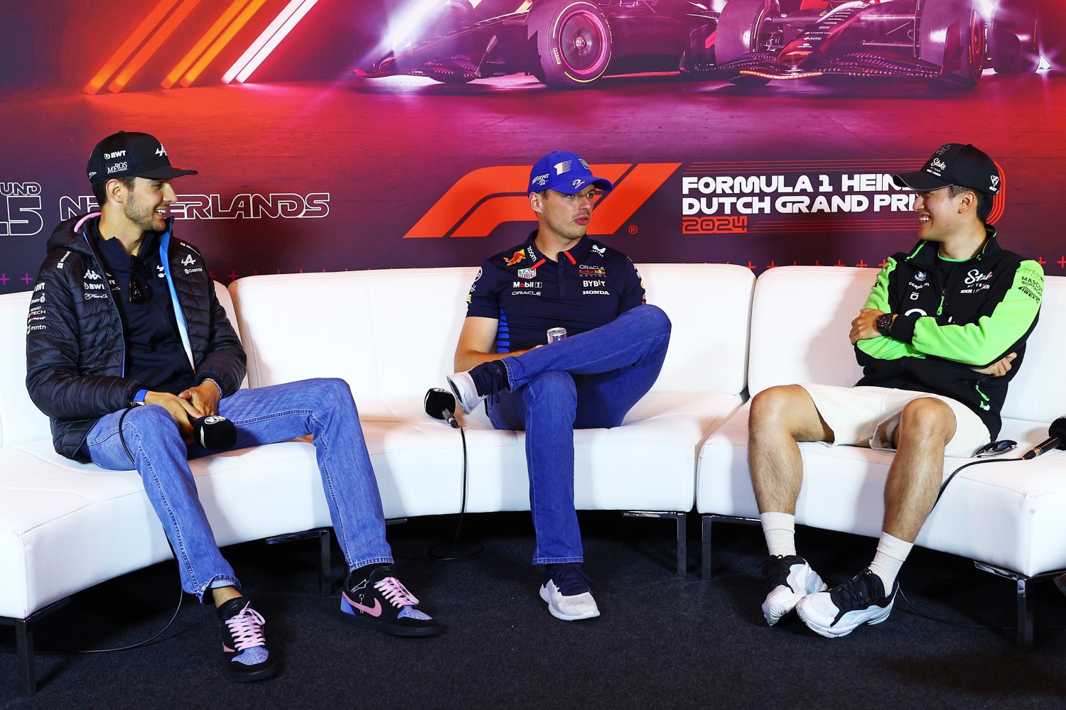 Esteban Ocon of France and Alpine F1, Max Verstappen of the Netherlands and Oracle Red Bull Racing and Zhou Guanyu of China and Stake F1 Team Kick Sauber attend the Drivers Press Conference during previews ahead of the F1 Grand Prix of Netherlands at Circuit Zandvoort on August 22, 2024 in Zandvoort, Netherlands. (Photo by Clive Rose/Getty Images)