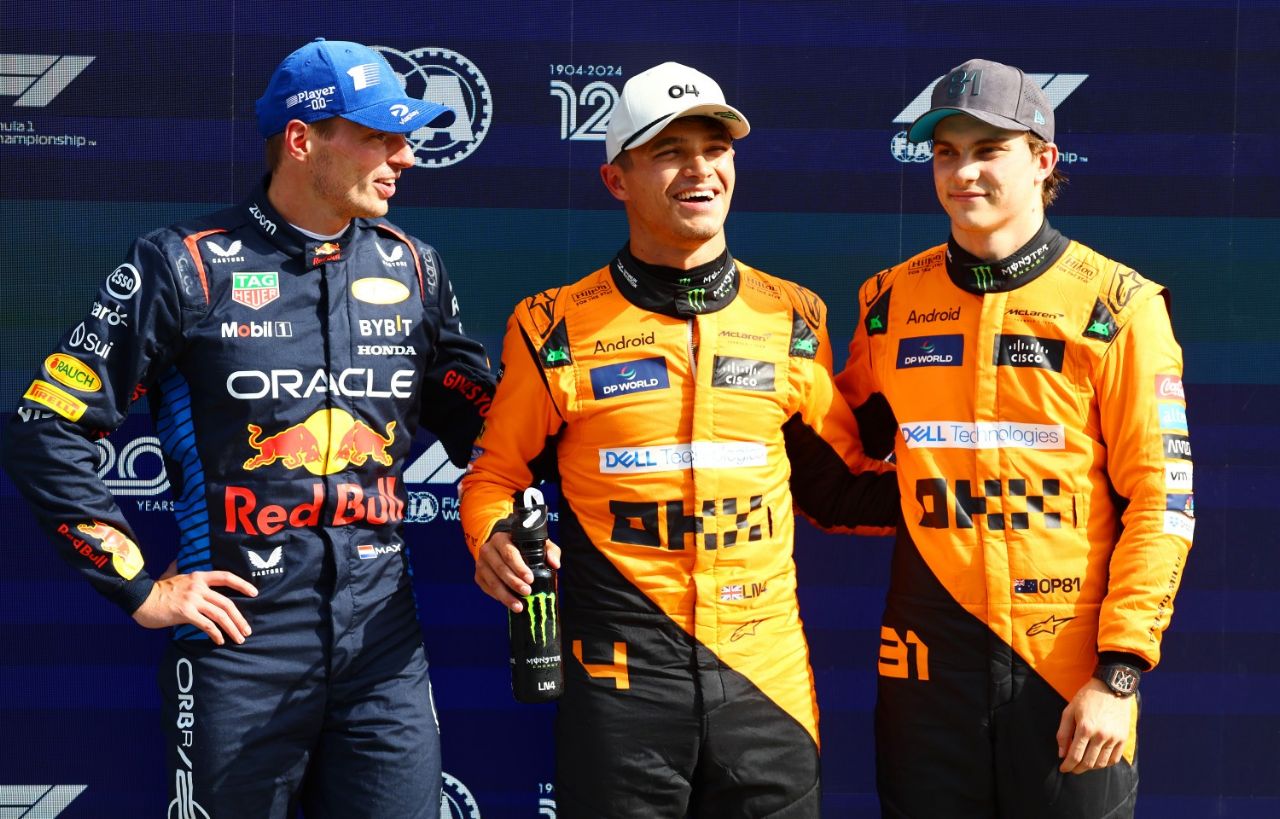 Second placed qualifier Max Verstappen of the Netherlands and Oracle Red Bull Racing, pole position qualifier Lando Norris of Great Britain and McLaren and third placed qualifier Oscar Piastri of Australia and McLaren react in parc ferme after qualifying ahead of the F1 Grand Prix of Netherlands at Circuit Zandvoort on August 24, 2024 in Zandvoort, Netherlands. (Photo by Mark Thompson/Getty Images)