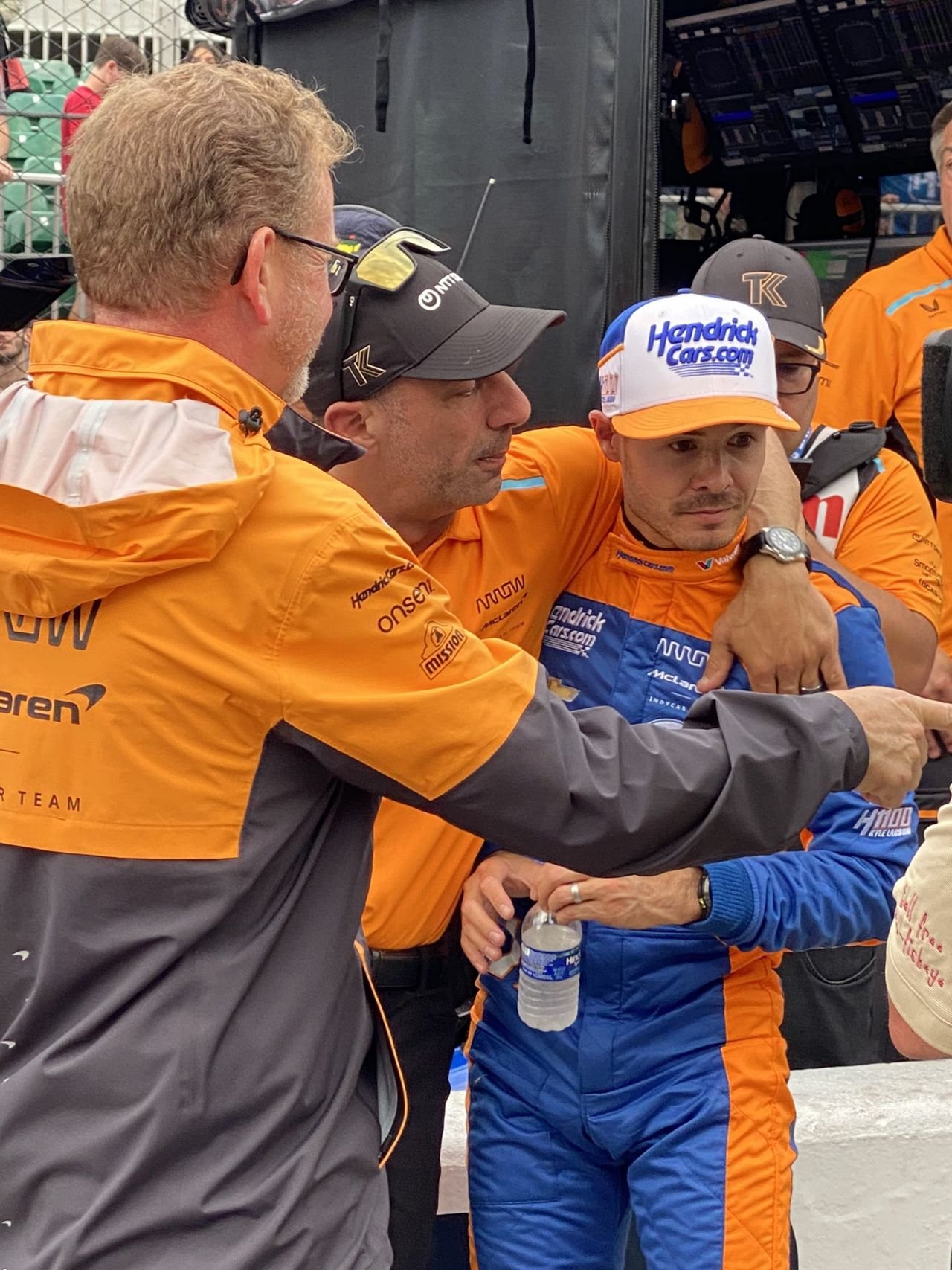 Tony Kanaan trying to make Kyle Larson feel better after a speeding penalty derails his day. He’ll try again next year.