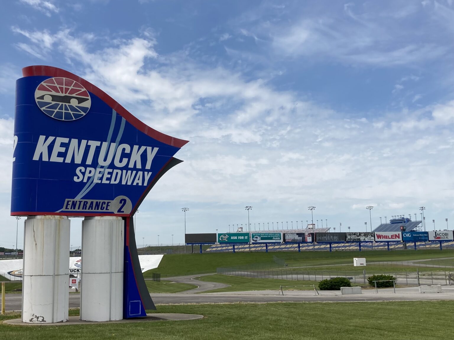 The Kentucky Speedway is now home to Ford trucks awaiting distribution after NASCAR abandoned the track in 2020. (Kentucky Lantern photo by Tim Sullivan)