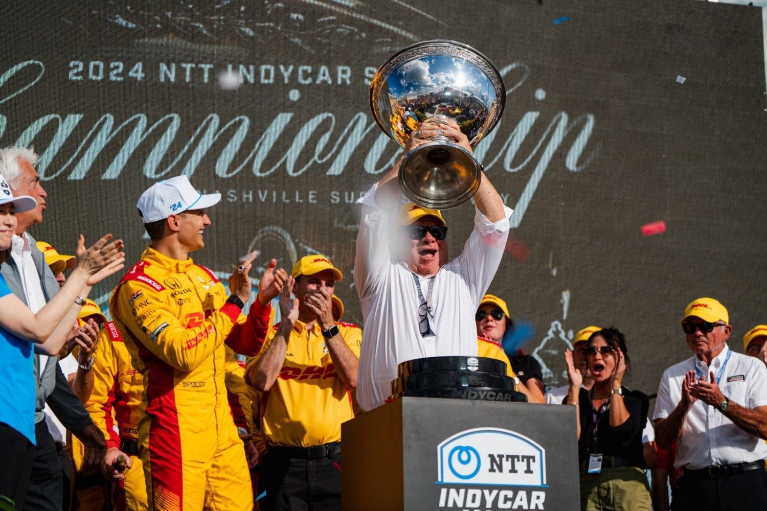 Team owner Chip Ganassi celebrates with 2024 NTT IndyCar champion Alex Palou