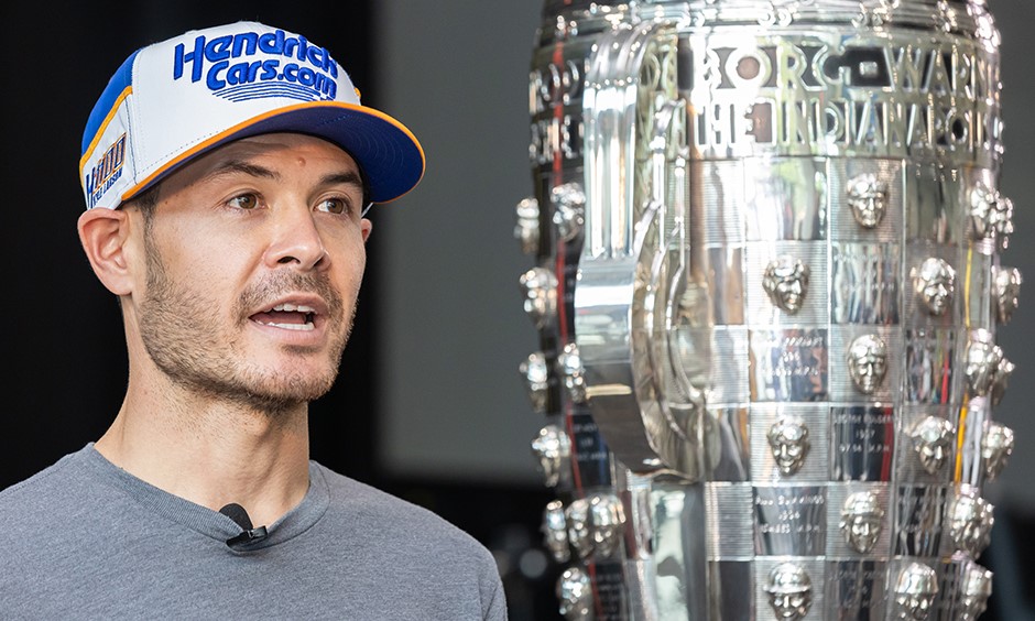 Kyle Larson with the famous Borg Warner Trophy he hopes to someday be on