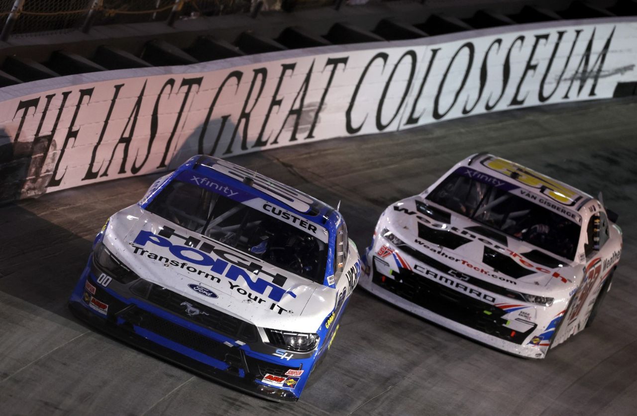 Cole Custer, driver of the #00 HighPoint.com Ford, and Shane Van Gisbergen, driver of the #97 WeatherTech Chevrolet, race during the NASCAR Xfinity Series Food City 300 at Bristol Motor Speedway on September 20, 2024 in Bristol, Tennessee. (Photo by James Gilbert/Getty Images)