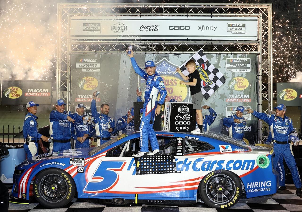 Kyle Larson and his son Owen celebrate on top of Larson's Chevy Camaro Saturday night in Bristol Motor Speedway Victory Lane after Larson won his second Bass Pro Shops Night Race title. With the victory Larson advanced to the NASCAR Playoffs Round of 12.