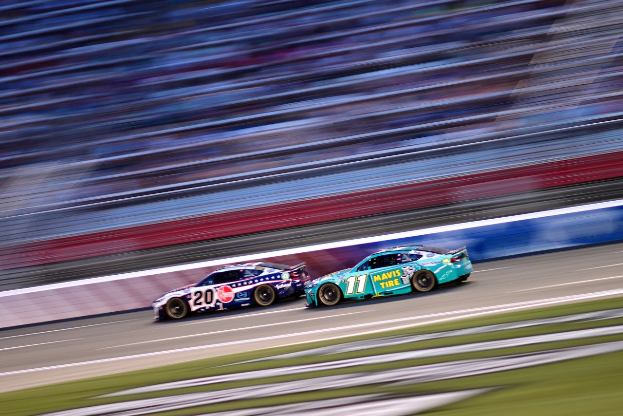 Denny Hamlin, driver of the #11 Mavis Tire Toyota, and Christopher Bell, driver of the #20 Rheem Toyota, race during the NASCAR Cup Series Coca-Cola 600 at Charlotte Motor Speedway on May 26, 2024 in Concord, North Carolina. (Photo by Logan Riely/Getty Images for NASCAR)