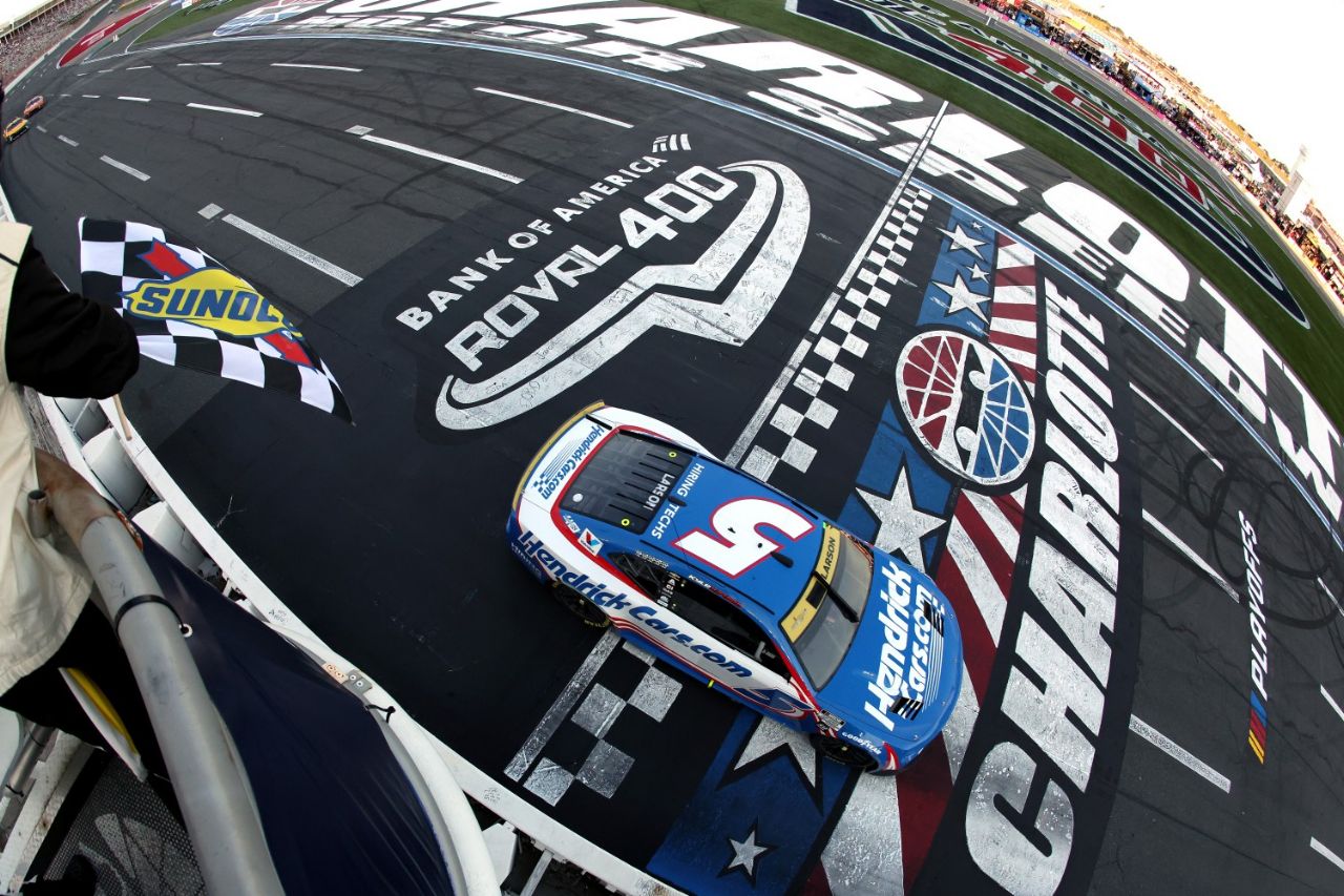 Kyle Larson, driver of the #5 HendrickCars.com Chevrolet, takes the checkered flag to win the NASCAR Cup Series Bank of America ROVAL 400 at Charlotte Motor Speedway on October 13, 2024 in Concord, North Carolina. (Photo by Meg Oliphant/Getty Images)