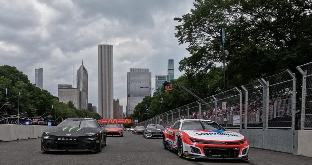 Kyle Larson, driver of the #5 Valvoline Chevrolet, and Ty Gibbs, driver of the #54 Monster Energy Toyota, lead the field on a pace lap prior to the NASCAR Cup Series Grant Park 165 at Chicago Street Course on July 07, 2024 in Chicago, Illinois. (Photo by Jared C. Tilton/Getty Images) | Getty Images