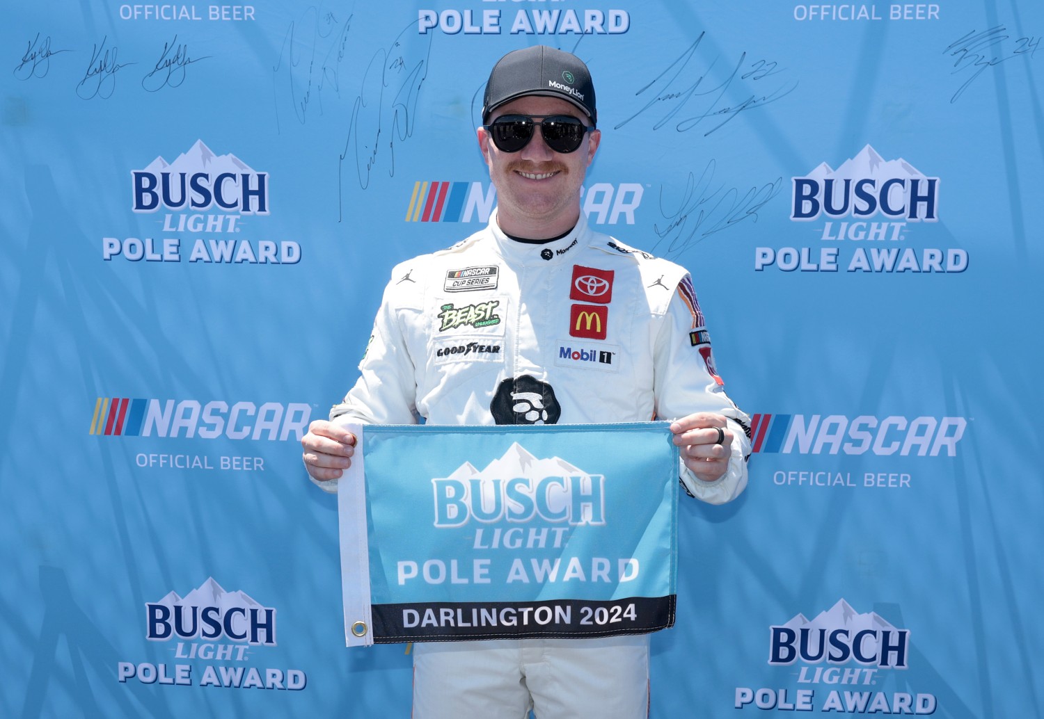 Tyler Reddick, driver of the #45 MoneyLion Toyota, poses for photos after winning the pole award during qualifying for the the NASCAR Cup Series Goodyear 400 at Darlington Raceway on May 11, 2024 in Darlington, South Carolina. (Photo by James Gilbert/Getty Images)