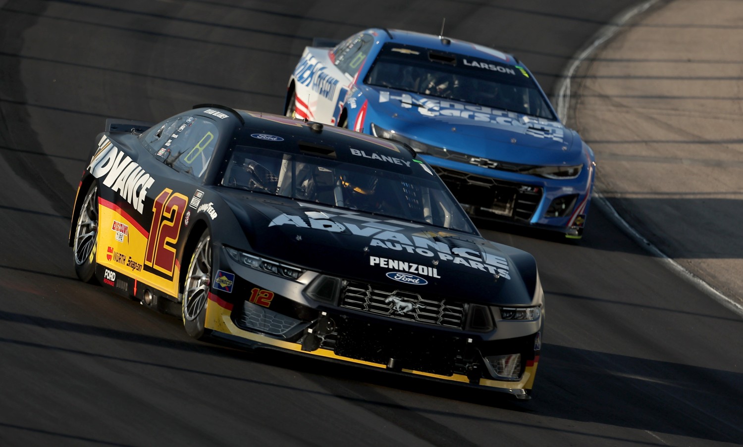 Ryan Blaney, driver of the #12 Advance Auto Parts Ford, leads Kyle Larson during the NASCAR Cup Series Iowa Corn 350 at Iowa Speedway on June 16, 2024 in Newton, Iowa. (Photo by Jonathan Bachman/Getty Images for NASCAR)