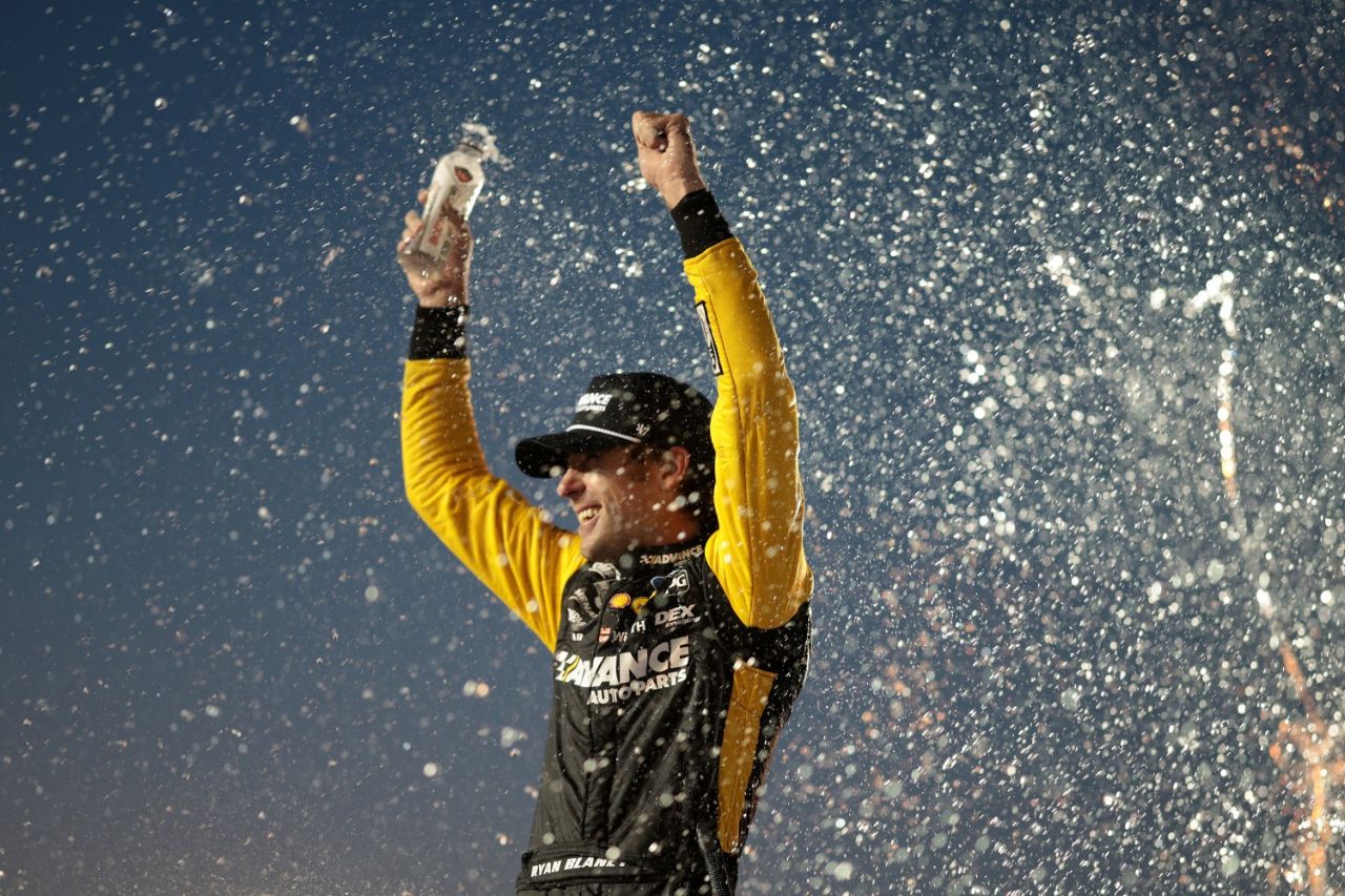 Ryan Blaney, driver of the #12 Advance Auto Parts Ford, celebrates in victory lane after winning during the NASCAR Cup Series Iowa Corn 350 at Iowa Speedway on June 16, 2024 in Newton, Iowa. (Photo by James Gilbert/Getty Images for NASCAR)