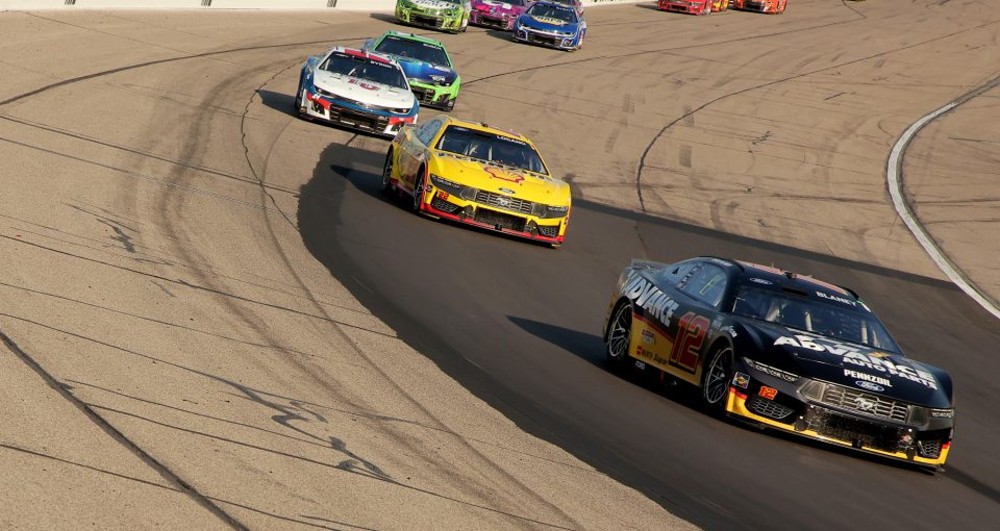 Ryan Blaney, driver of the #12 Advance Auto Parts Ford, leads a pack of cars during the NASCAR Cup Series Iowa Corn 350 at Iowa Speedway on June 16, 2024 in Newton, Iowa. (Photo by Jonathan Bachman/Getty Images) | Getty Images