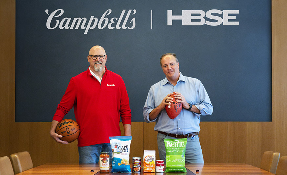 Harris Blitzer Sports &; Entertainment and Campbell Soup Co. announced a new marketing partnership spanning four sports franchises. Shown from left are Campbell’s President and CEO Mark Clouse and HBSE CEO Tad Brown. - PROVIDED BY HBSE