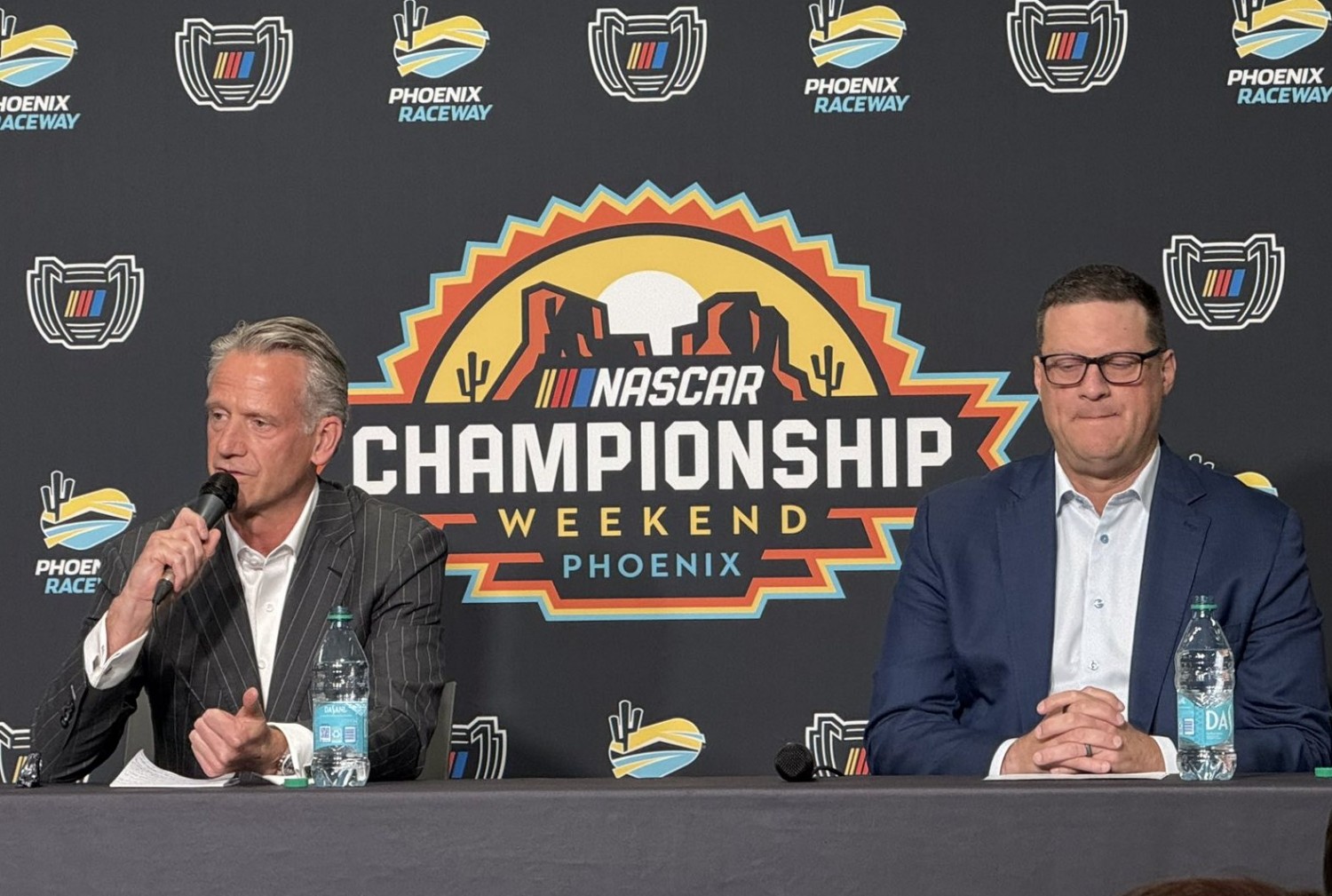 NASCAR President Steve Phelps (L) and NASCAR chief operating officer Steve O’Donnell talk to the media at Phoenix Raceway during the 2024 NASCAR finale