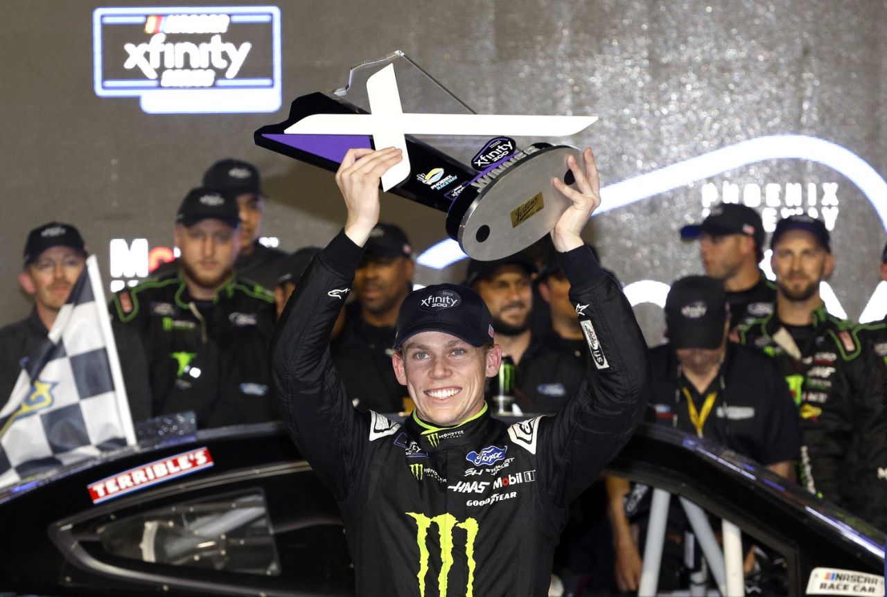 Riley Herbst, driver of the #98 Monster Energy Ford, celebrates in victory lane after winning the NASCAR Xfinity Series Championship Race at Phoenix Raceway on November 09, 2024 in Avondale, Arizona. (Photo by Sean Gardner/Getty Images)