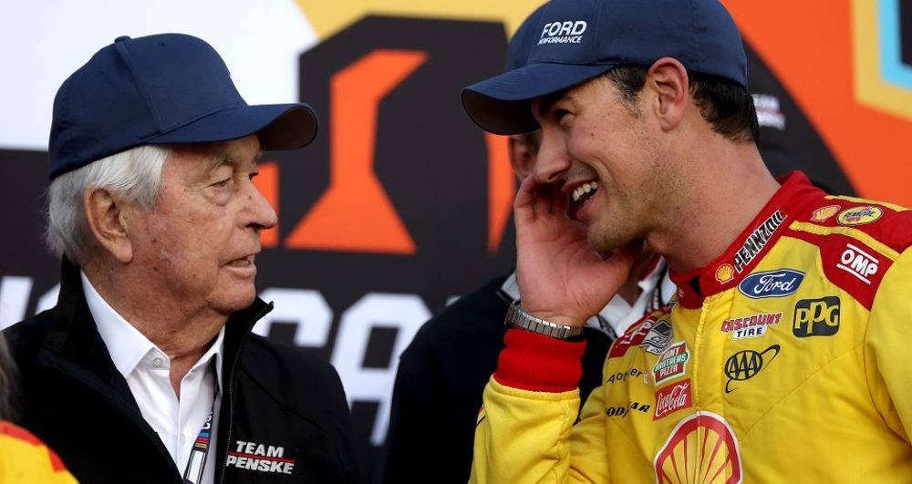 Joey Logano, driver of the #22 Shell Pennzoil Ford, speaks to Team Penske owner, Roger Penske in victory lane after winning the NASCAR Cup Series Championship Race at Phoenix Raceway on November 10, 2024 in Avondale, Arizona. (Photo by James Gilbert/Getty Images for NASCAR)