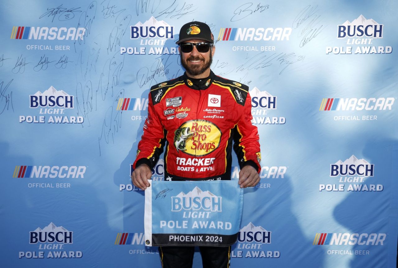 Martin Truex Jr., driver of the #19 Bass Pro Shops Toyota, poses for photos after winning the pole award during qualifying for the NASCAR Cup Series Championship Race at Phoenix Raceway on November 09, 2024 in Avondale, Arizona. (Photo by Chris Graythen/Getty Images for NASCAR)