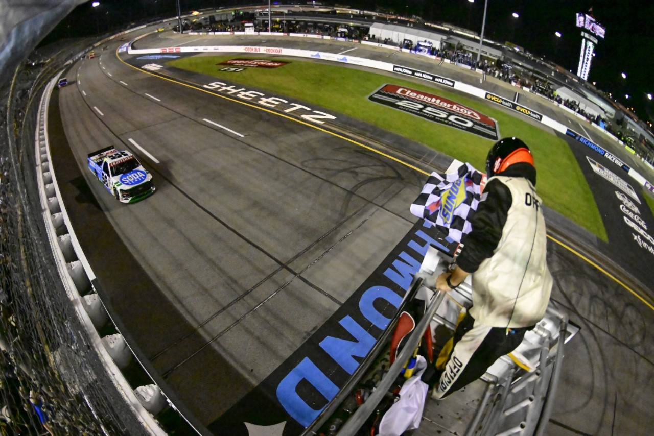 Ty Majeski, driver of the #98 Soda Sense/Curb Records Ford, takes the checkered flag to win the NASCAR Craftsman Truck Series Clean Harbors 250 at Richmond Raceway on August 10, 2024 in Richmond, Virginia. (Photo by Logan Whitton/Getty Images)