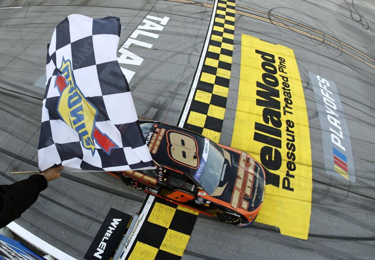 Sammy Smith, driver of the #8 TMC Transportation Chevrolet, takes the checkered flag to win the NASCAR Xfinity Series United Rentals 250 at Talladega Superspeedway on October 05, 2024 in Talladega, Alabama. (Photo by Chris Graythen/Getty Images for NASCAR)