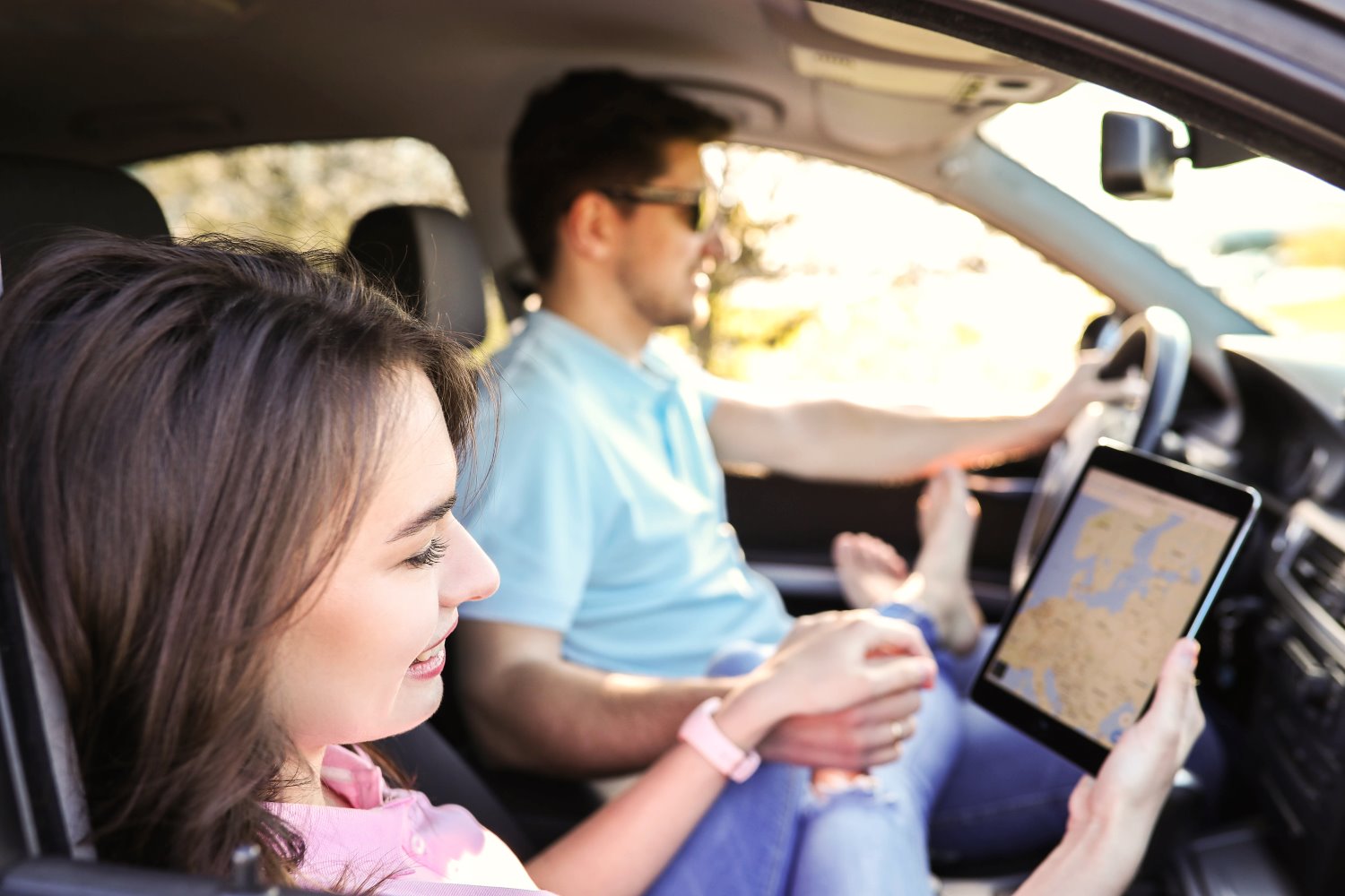 A couple is traveling in the car streaming ITV.