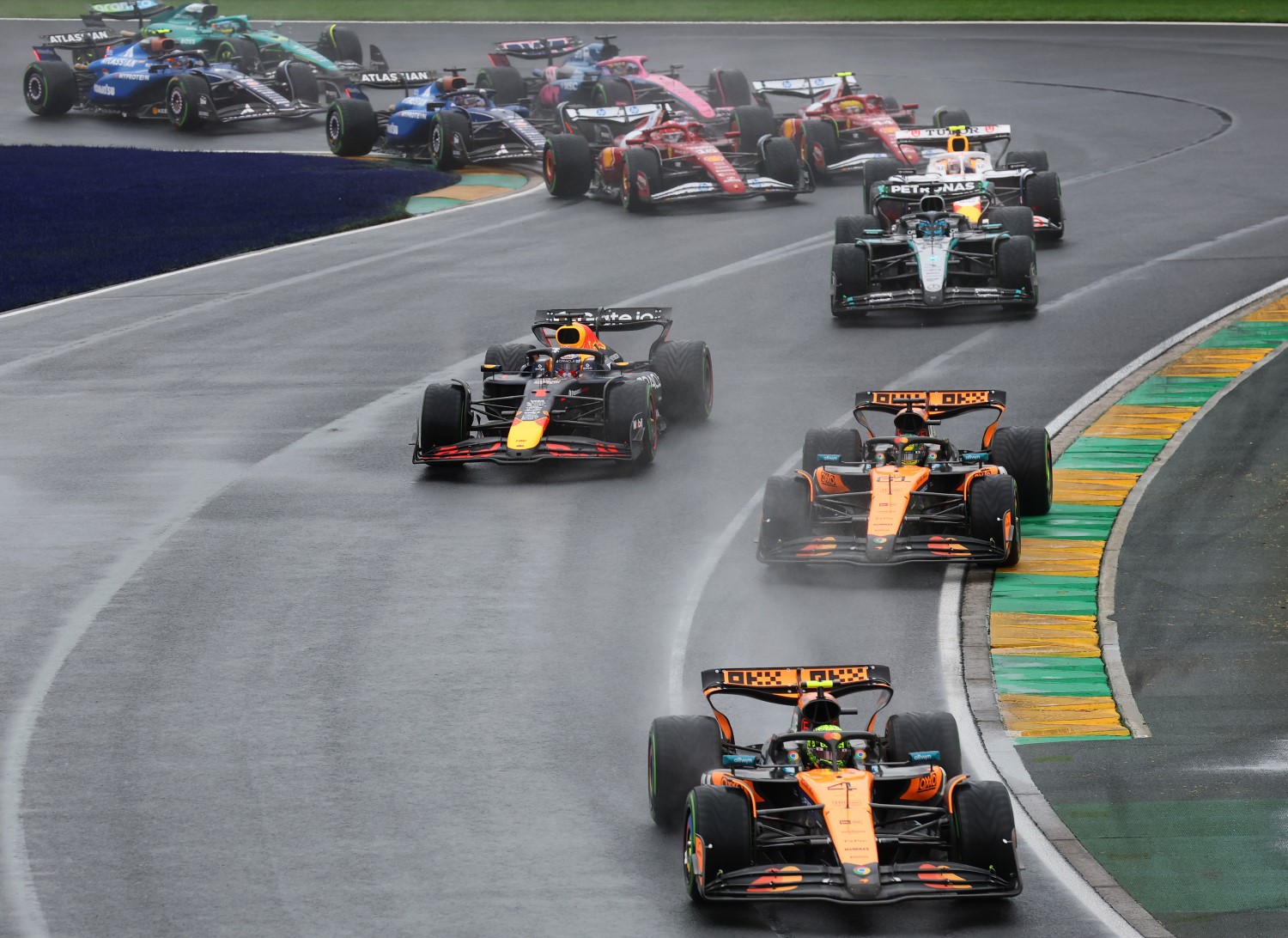 Lando Norris of Great Britain driving the (4) McLaren MCL39 Mercedes leads Oscar Piastri of Australia driving the (81) McLaren MCL39 Mercedes Max Verstappen of the Netherlands driving the (1) Oracle Red Bull Racing RB21 and the rest of the field at the start during the F1 Grand Prix of Australia at Albert Park Grand Prix Circuit on March 16, 2025 in Melbourne, Australia. (Photo by Mark Thompson/Getty Images for McLaren)