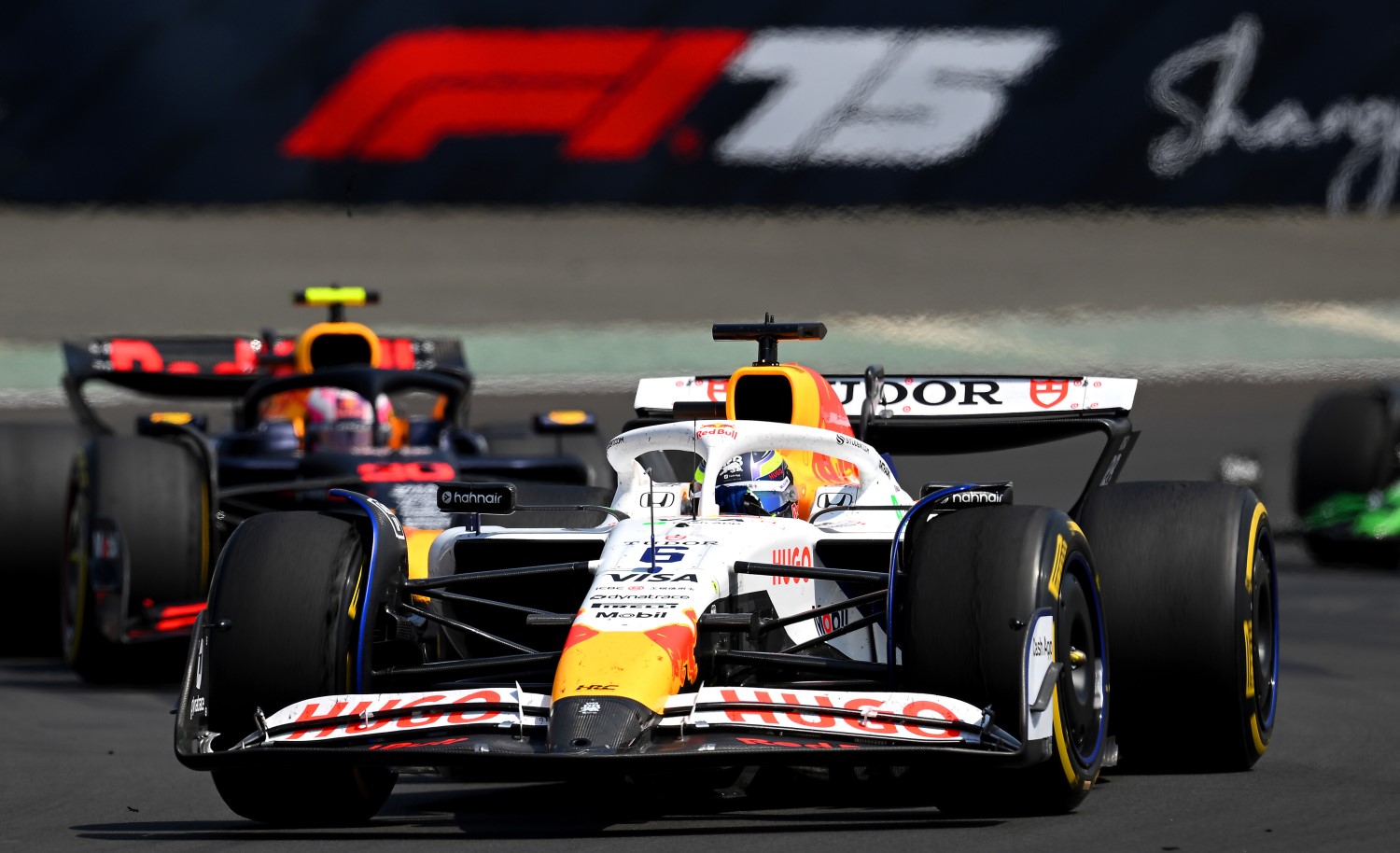 Isack Hadjar of France driving the (6) Visa Cash App Racing Bulls VCARB 02 leads Liam Lawson of New Zealand driving the (30) Oracle Red Bull Racing RB21 on track during the Sprint ahead of the F1 Grand Prix of China at Shanghai International Circuit on March 22, 2025 in Shanghai, China. (Photo by Clive Mason/Getty Images) // Getty Images / Red Bull Content Pool /